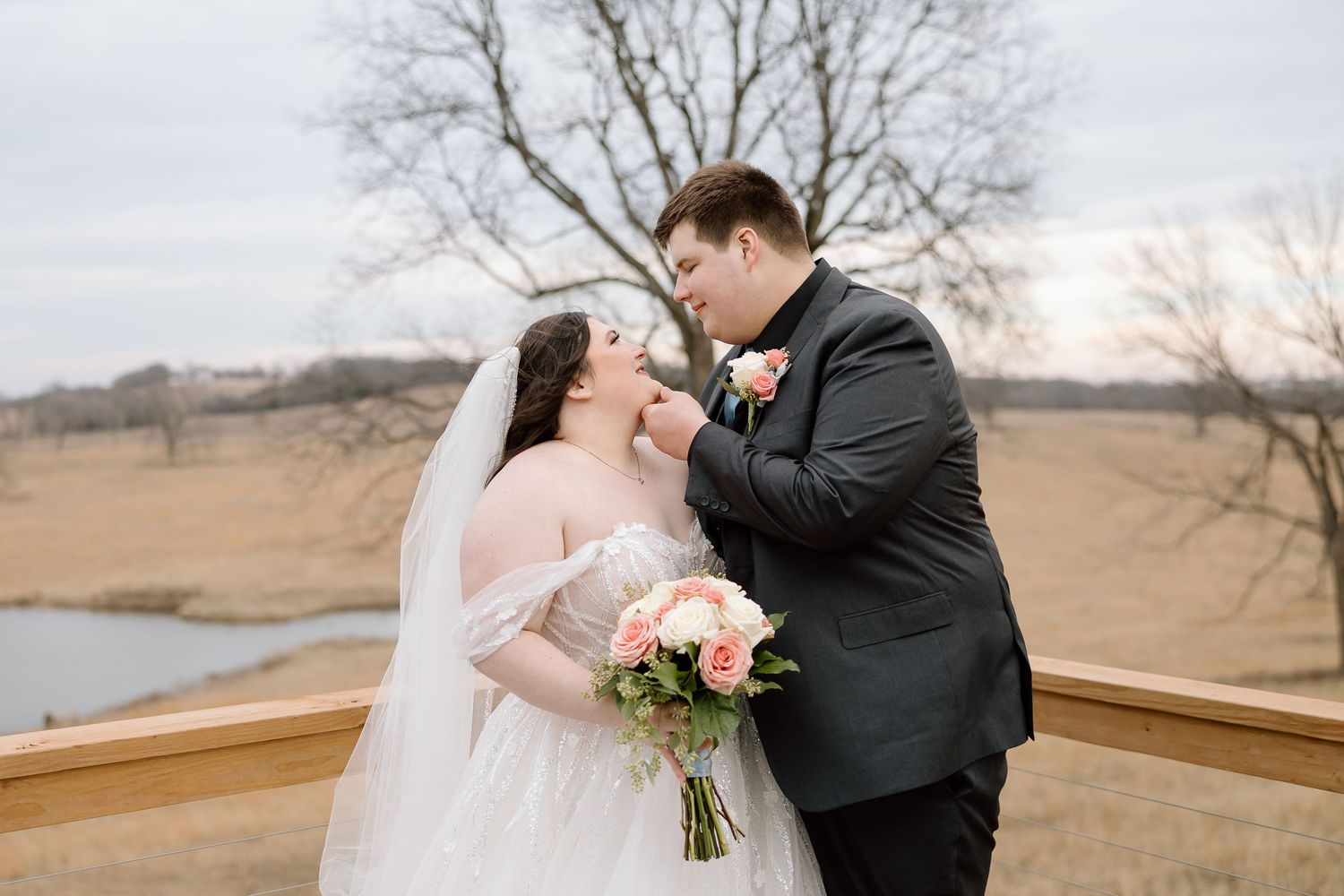 A romantic wedding couple shares intimate moments in various outdoor settings during their winter photo session.