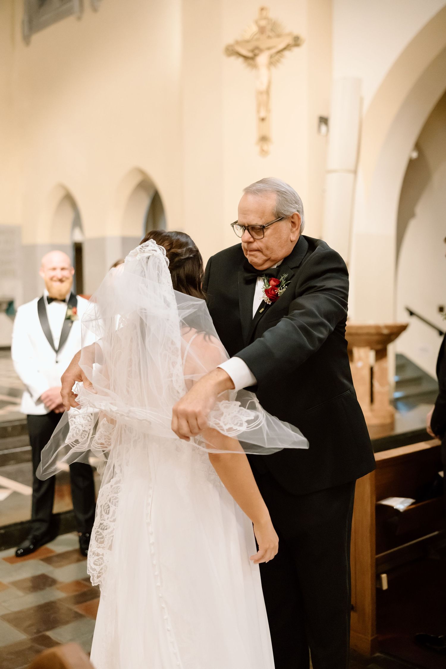 A tender moment shared between a couple during their wedding ceremony in a church setting.