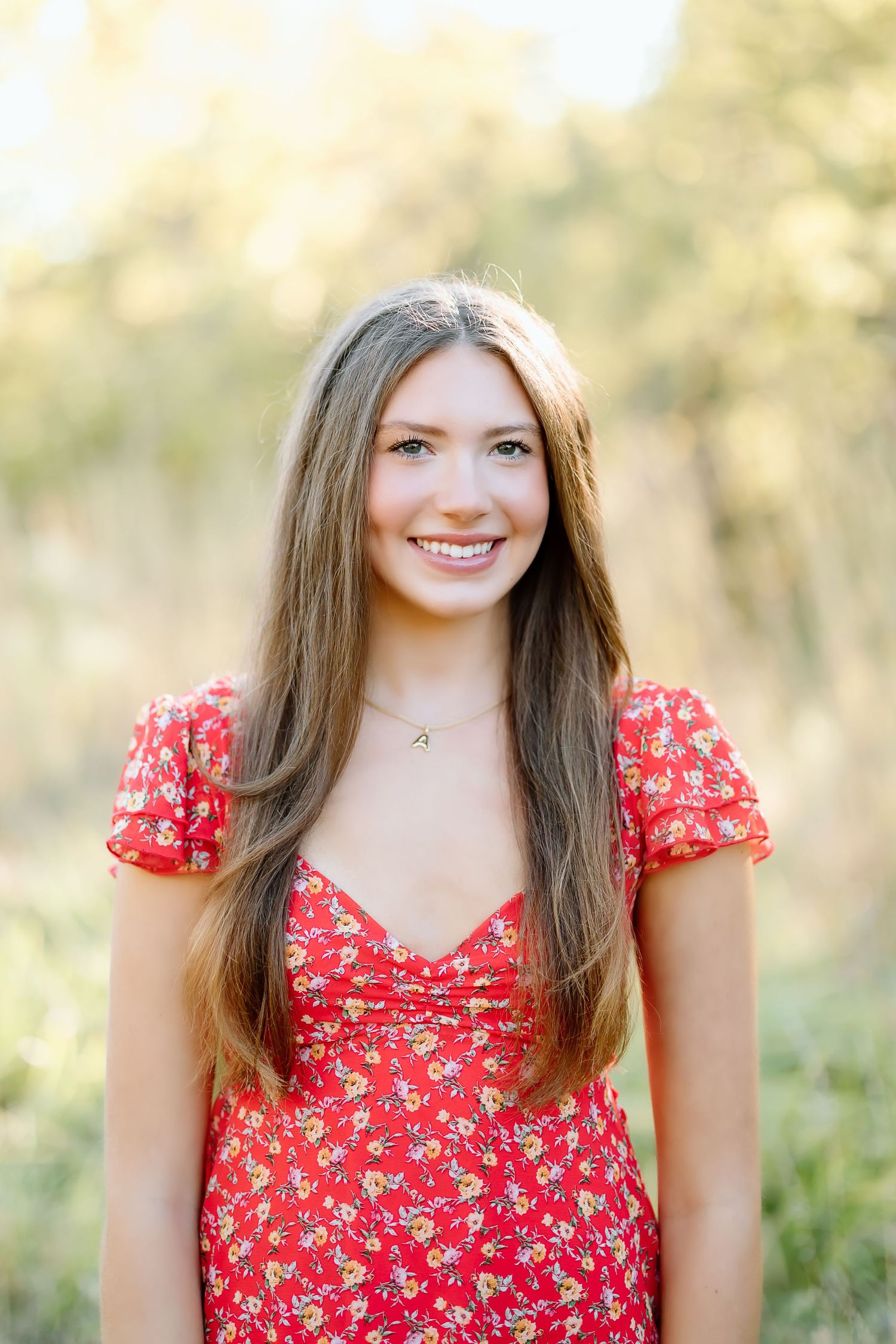 A series of four photos showing someone in a red floral dress with flutter sleeves against a soft natural background.