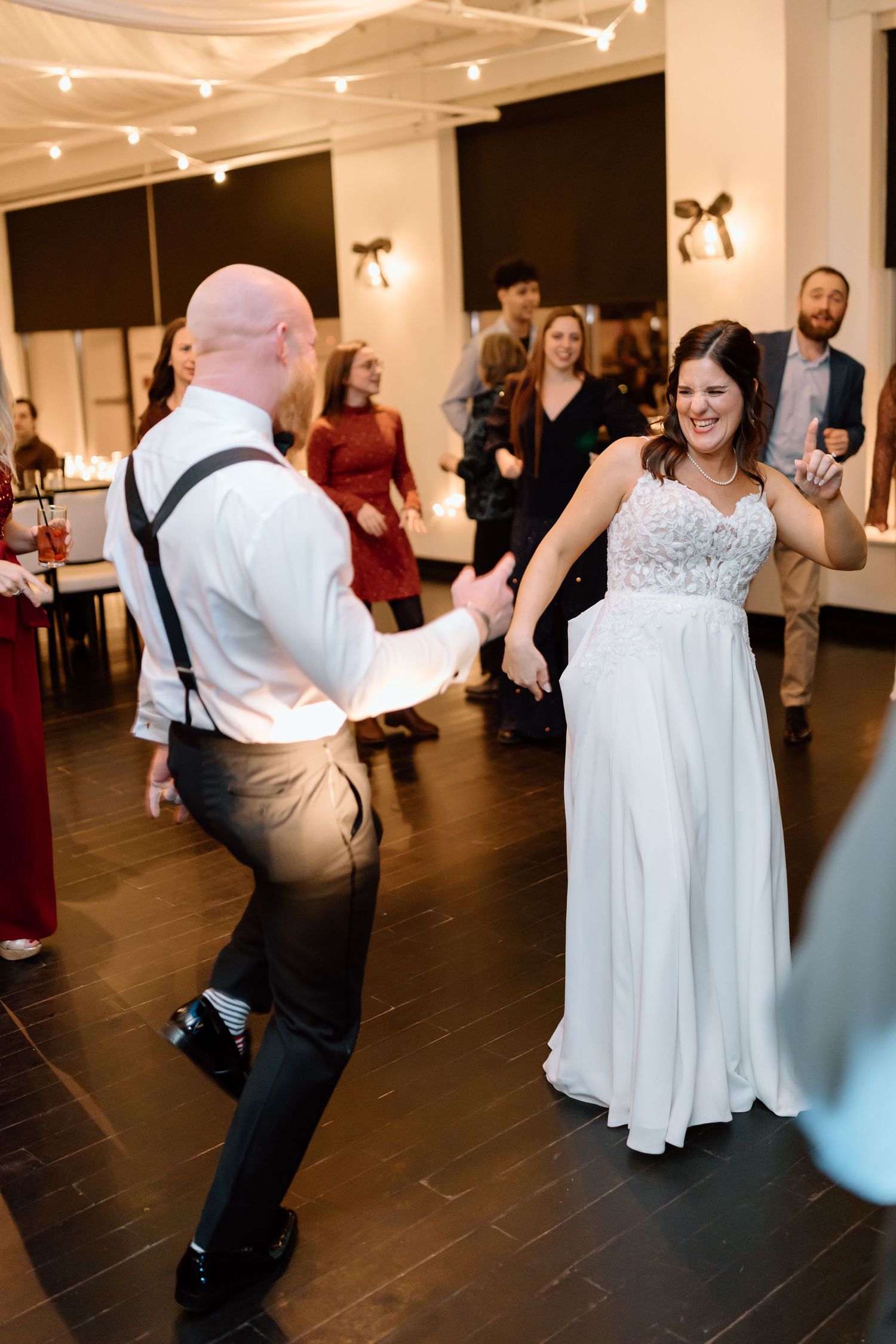 A sequence of wedding reception dance photos showing guests dancing energetically on a dark wood floor under indoor lighting.