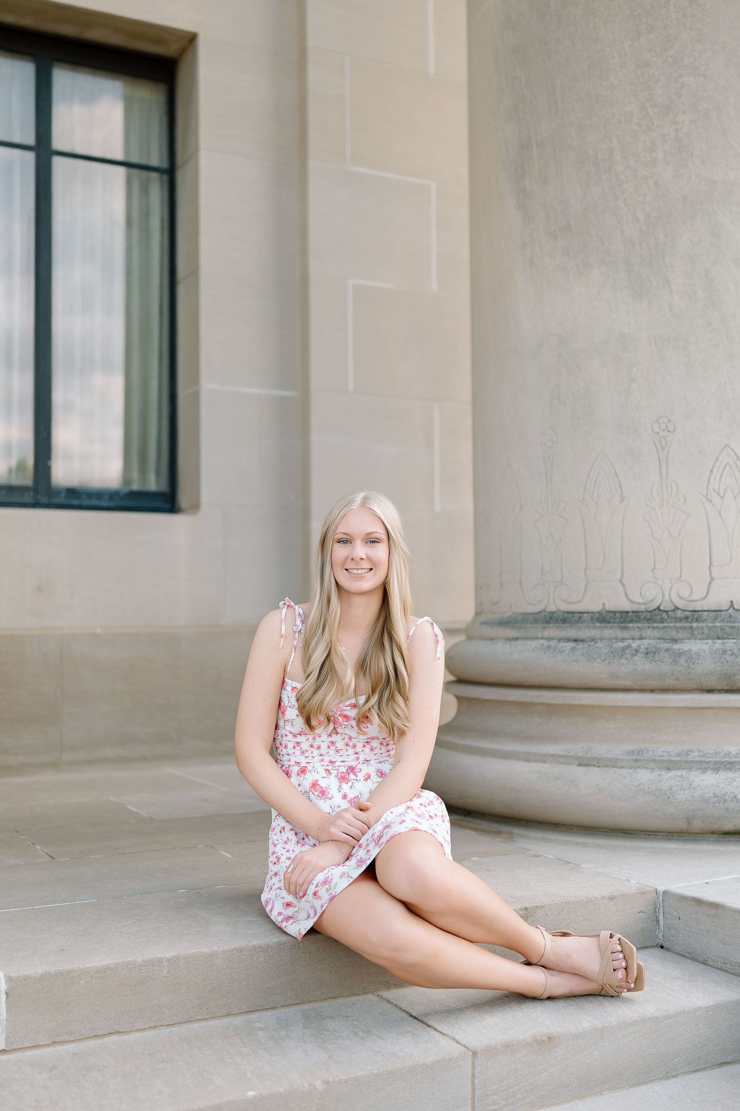 A series of casual portrait shots on concrete steps showing a person in a floral summer dress.