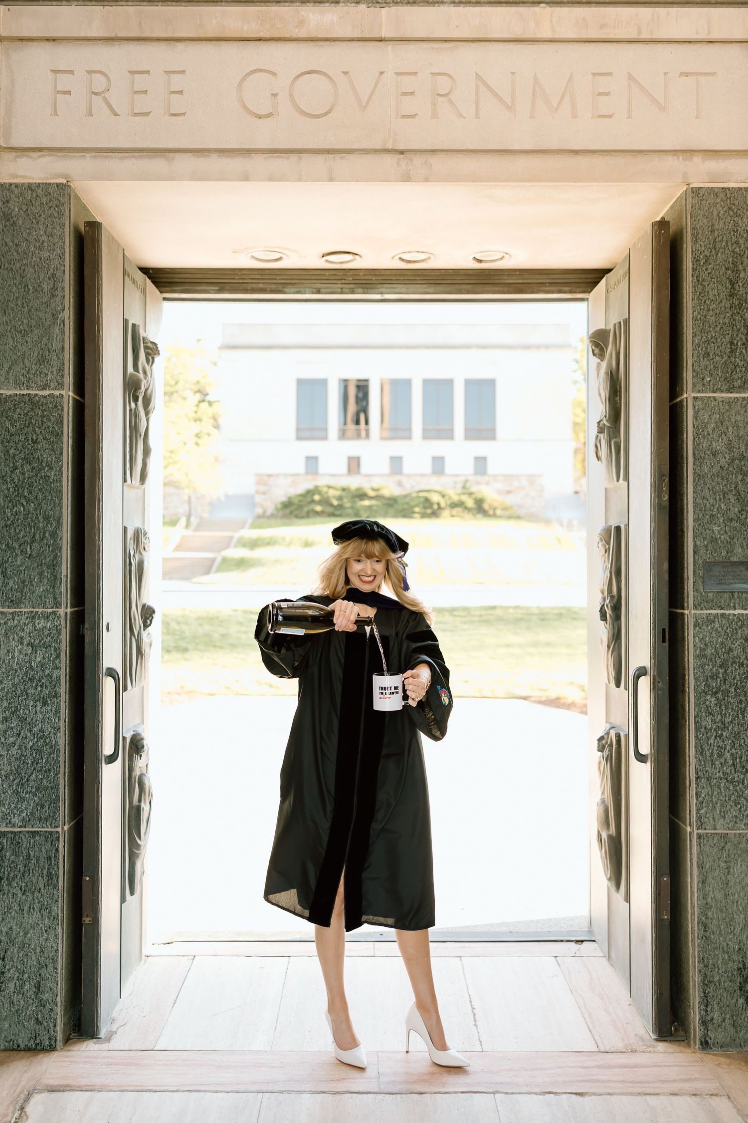 A series of five photos showing a person in black graduation attire posing in a building entrance.