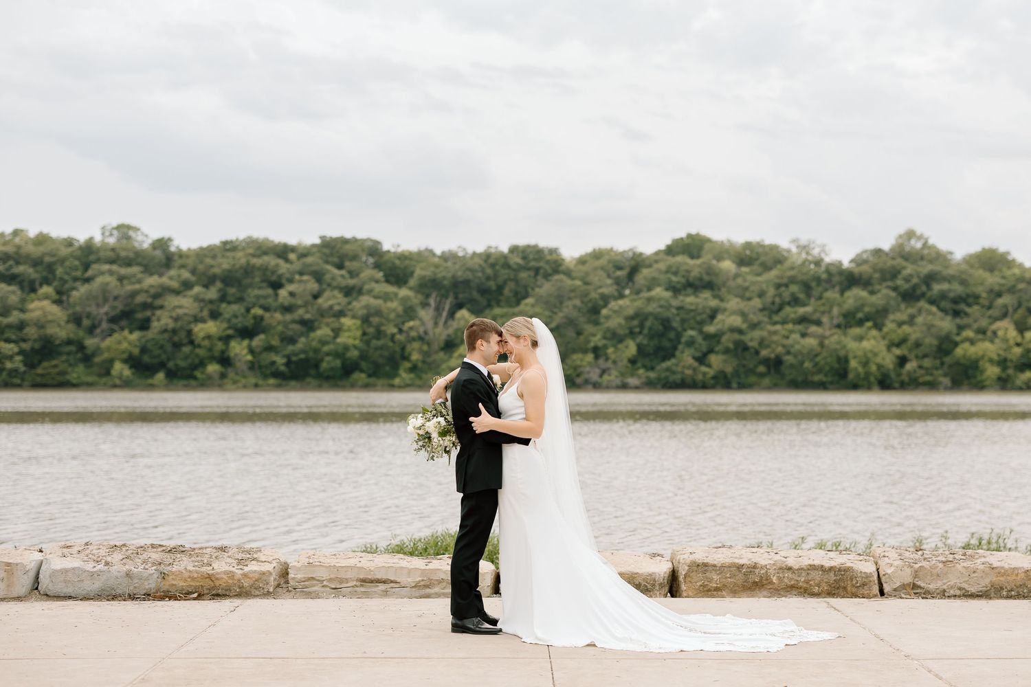 A series of elegant wedding photos showing couples along a scenic waterfront with lush greenery and natural settings.