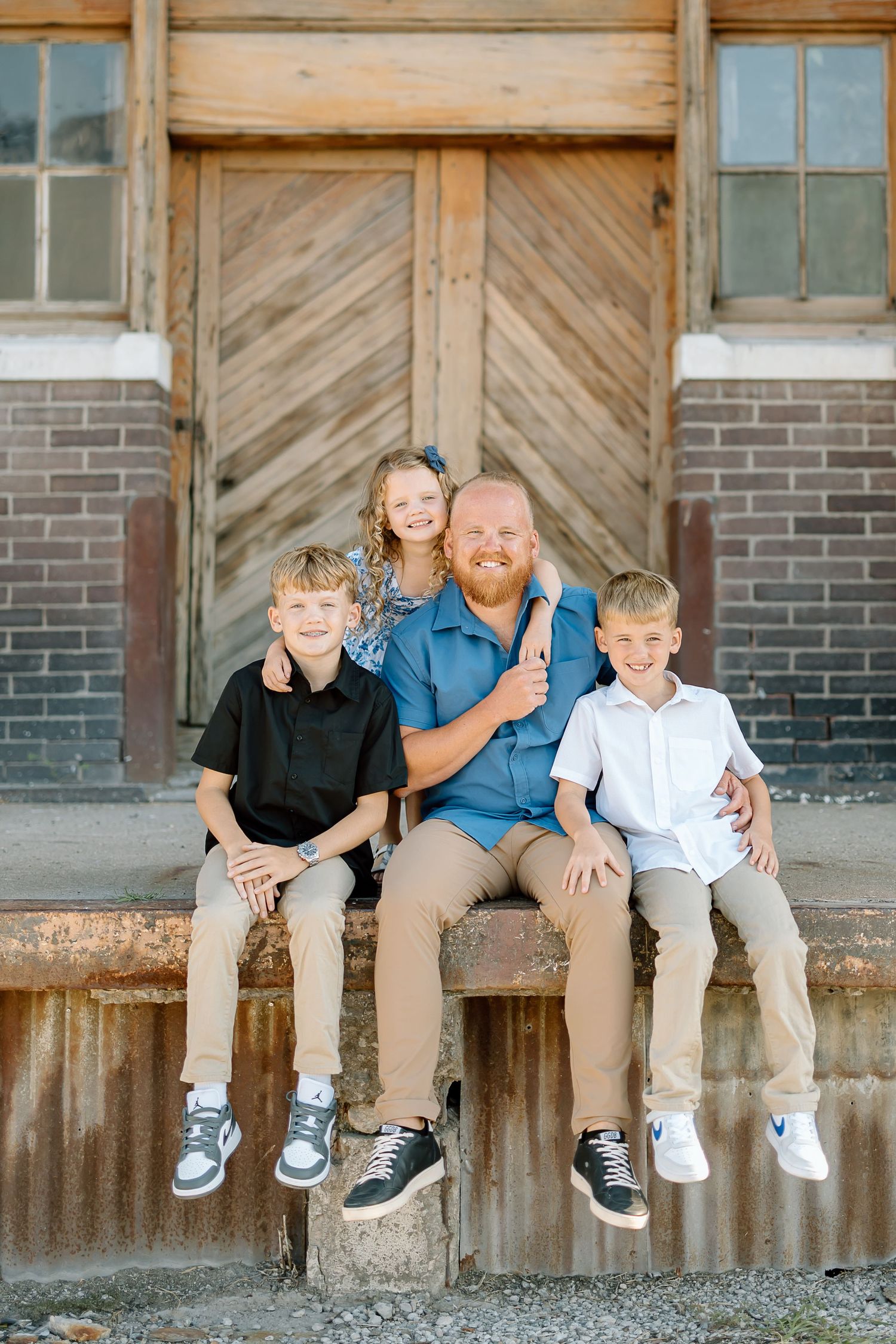 Three casual photos showing a group sitting together on a rustic concrete ledge against a weathered wooden wall.