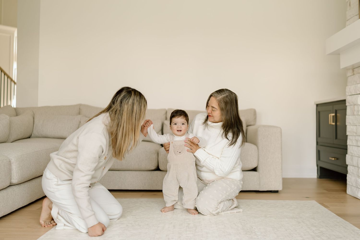 A series of connected images showing people in white clothing sitting and interacting on a light colored floor.