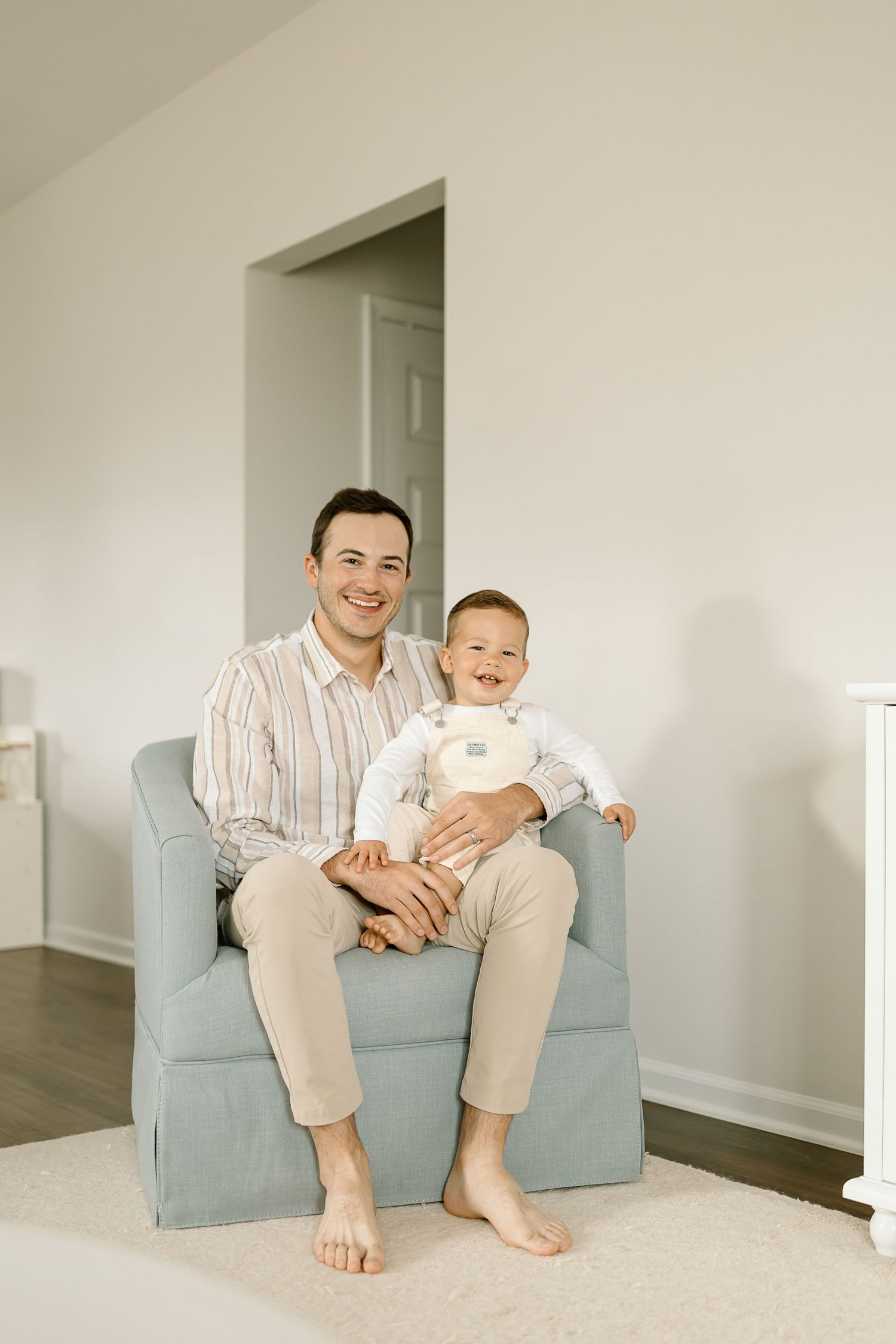 A series of minimalist photographs showing playful interaction on a light blue couch against white walls.
