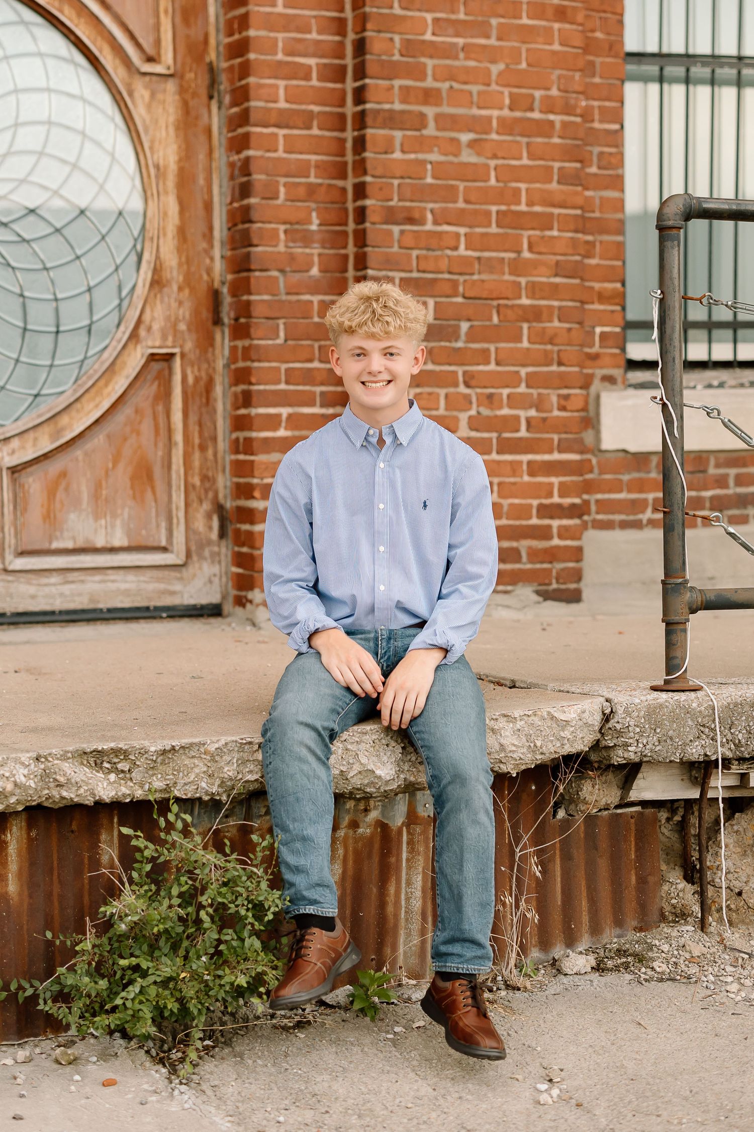 A sequence of three photos showing someone sitting on a brick building's concrete steps with round window details.