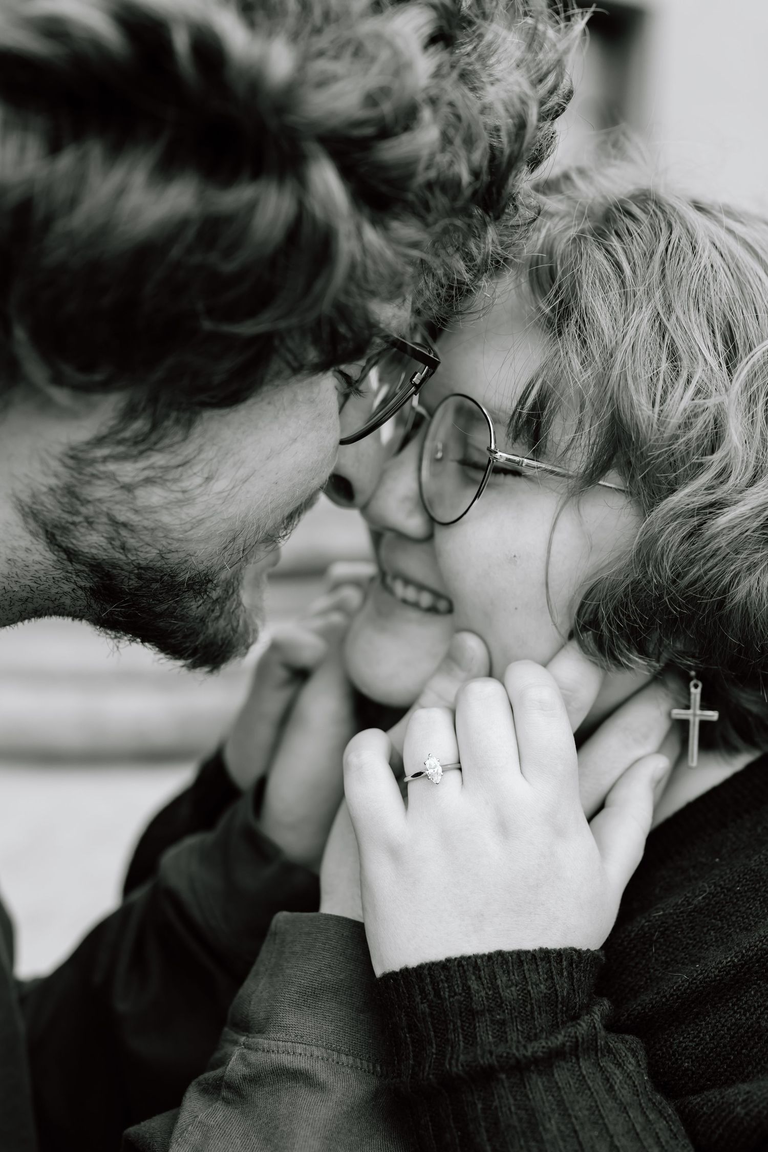 A black and white sequence of five images showing two people embracing and kissing in an intimate moment.