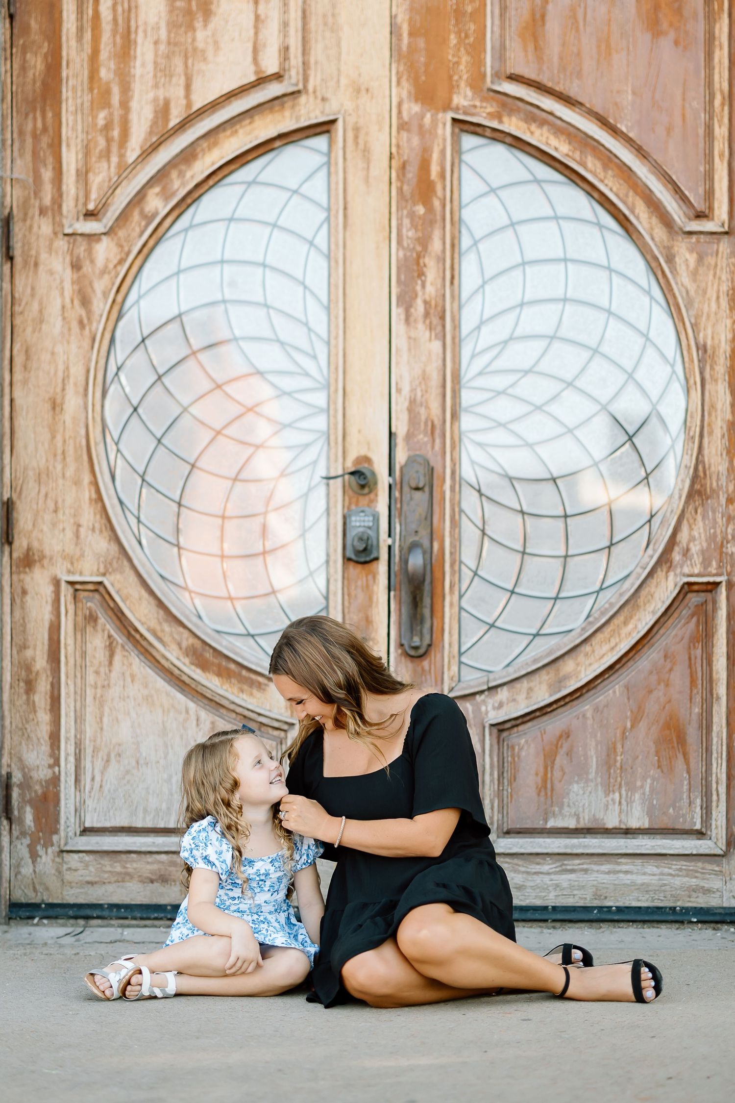 A sequence of four photos showing a person lying on the ground in front of a decorative wooden door with circular windows.
