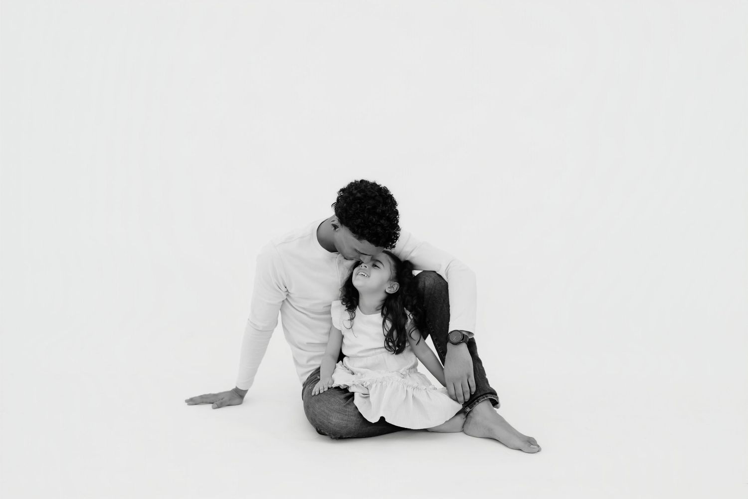 A series of minimalist black and white photos showing intimate dance poses and movements against a white background.