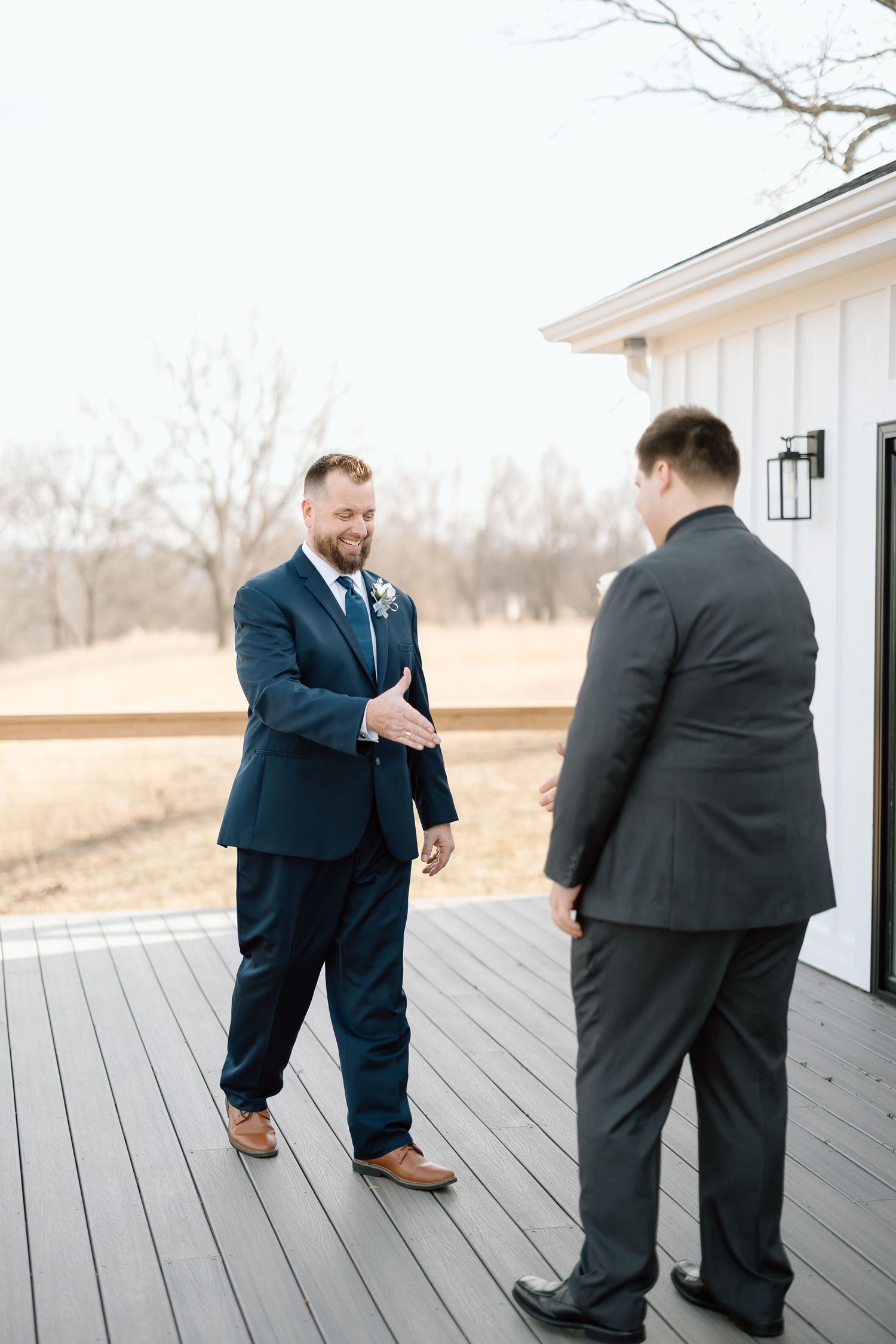 A sequence of photos showing a marriage proposal taking place on a wooden deck outside a white building.