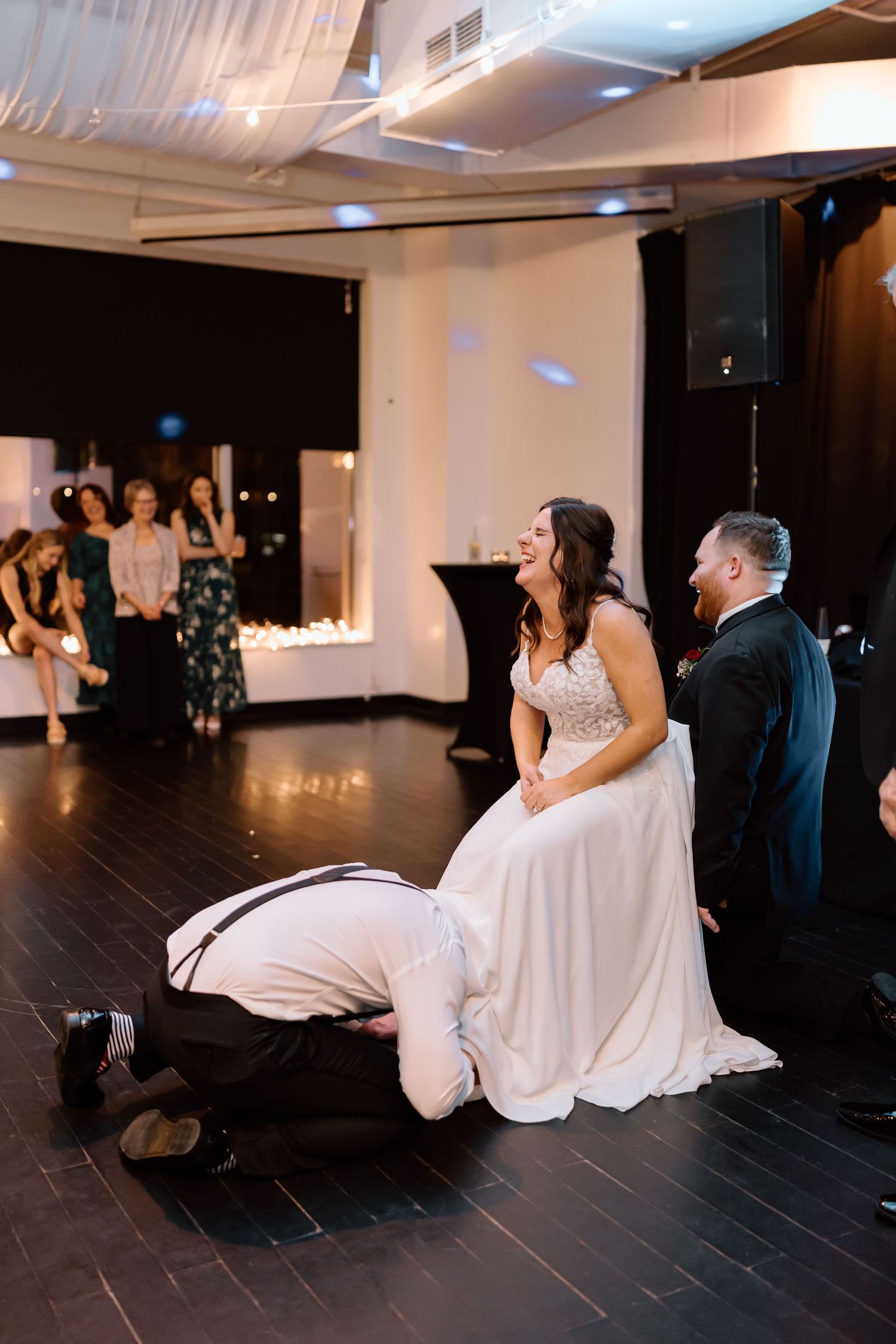 A romantic wedding dance sequence showing the couple in a dip pose across multiple frames on a dark wooden floor.