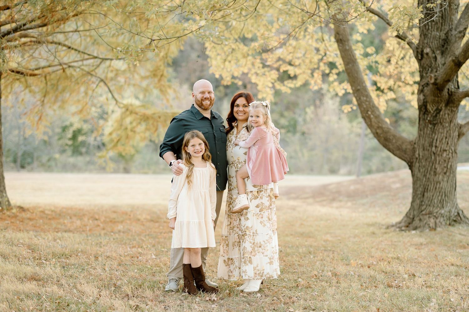 A series of autumn outdoor photos showing people walking and posing under golden trees in a park setting.