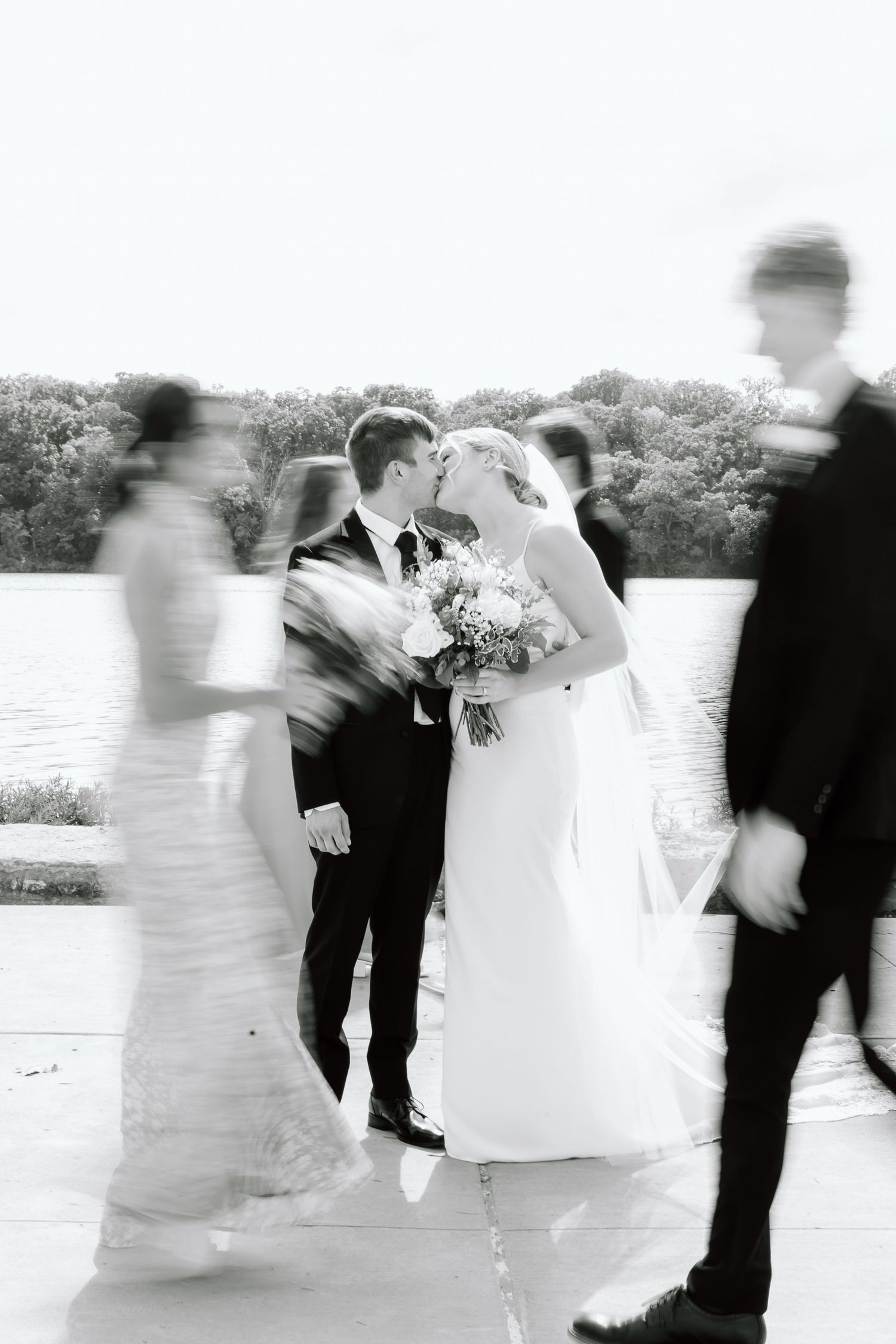A creative sequence showing movement and motion blur of a wedding couple dancing in black and white photography.