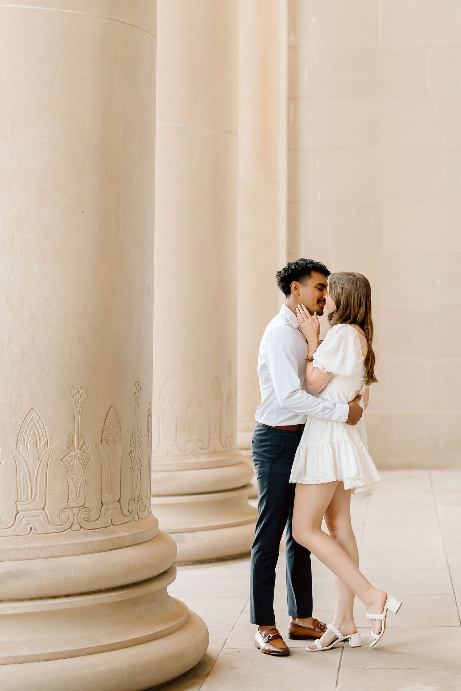 A romantic couple shares intimate moments against a backdrop of elegant white columns in a sequence of photos.