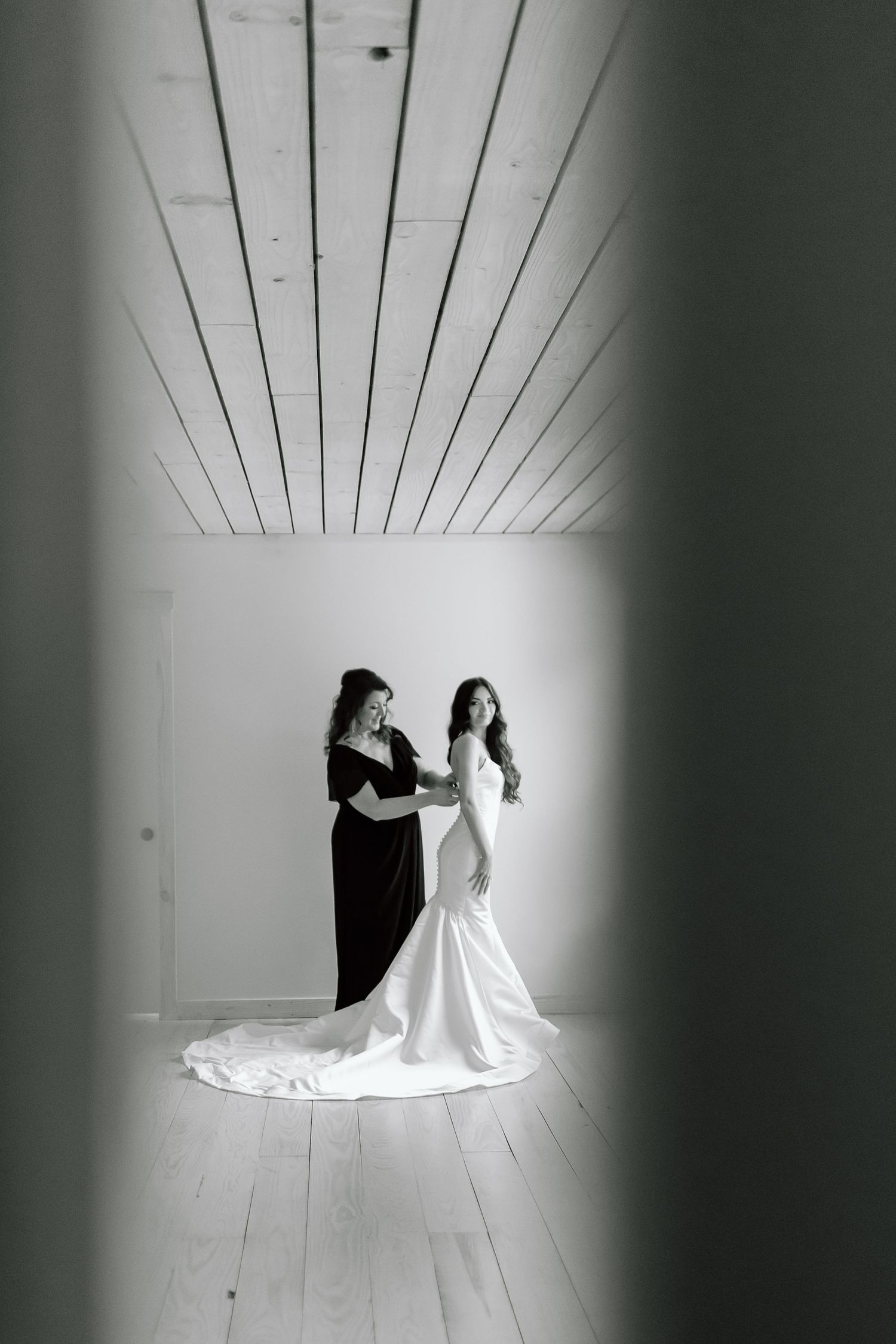 A series of black and white photos showing silhouettes of figures in wedding dresses against a bright white background.