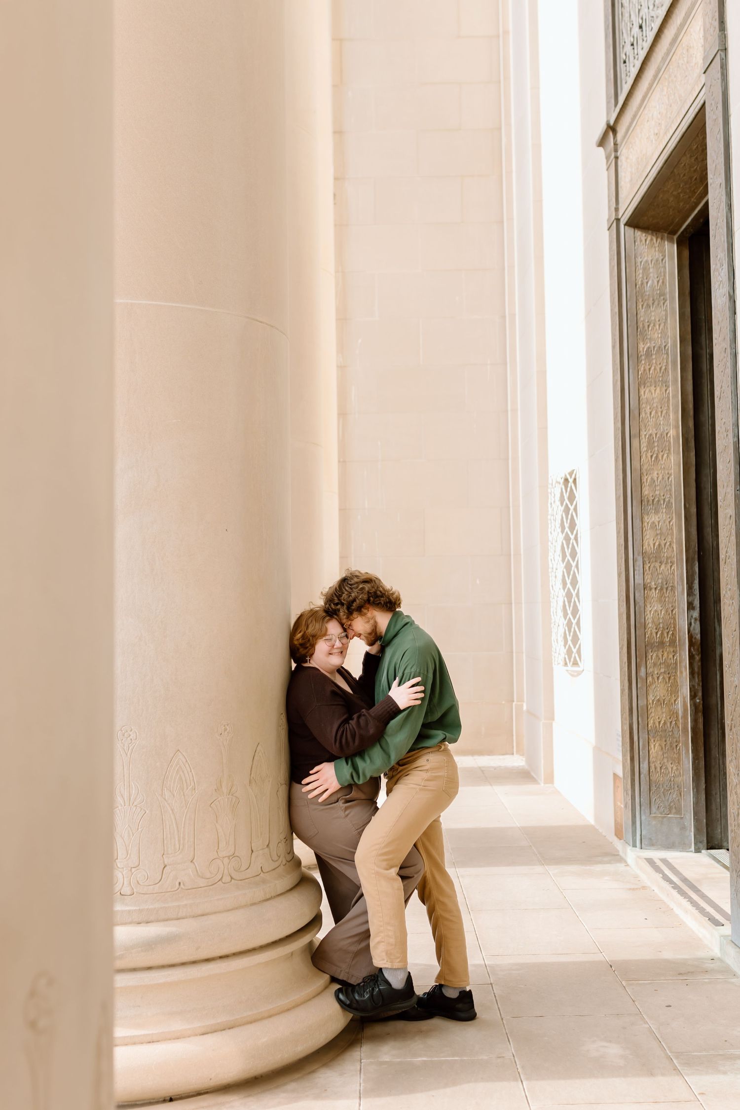 A series of four romantic sepia-toned photographs showing a couple embracing in an elegant columned hallway.
