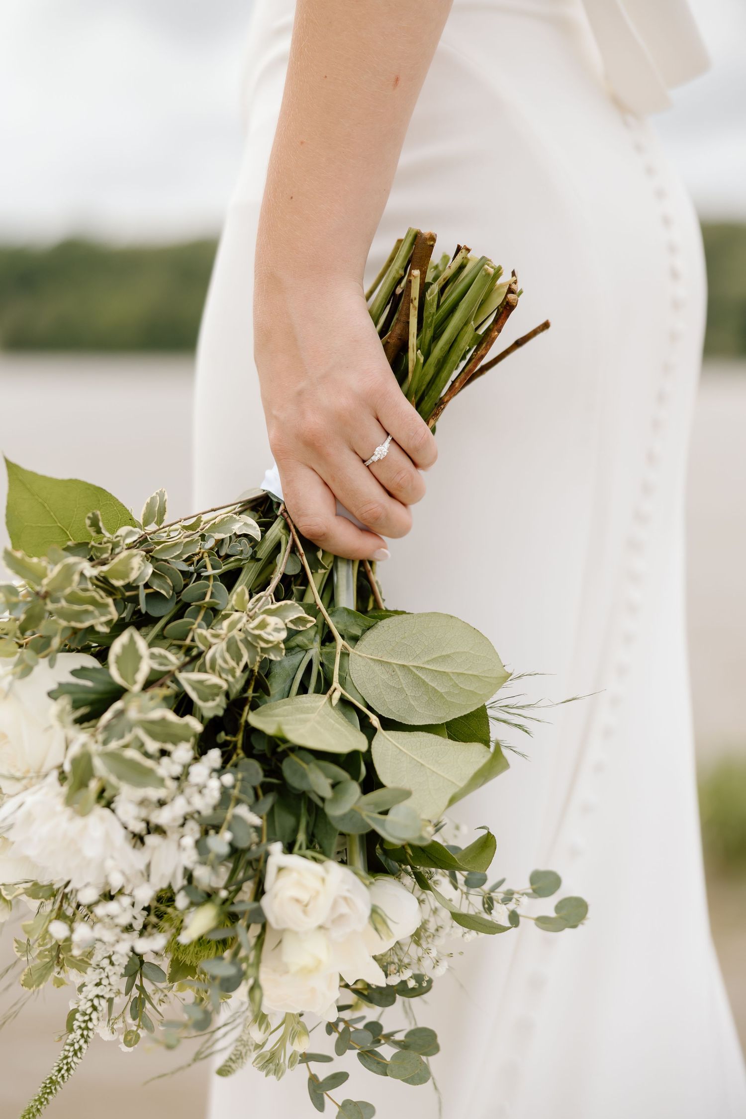 A white and green bridal bouquet with roses and eucalyptus leaves shown in multiple detail shots.