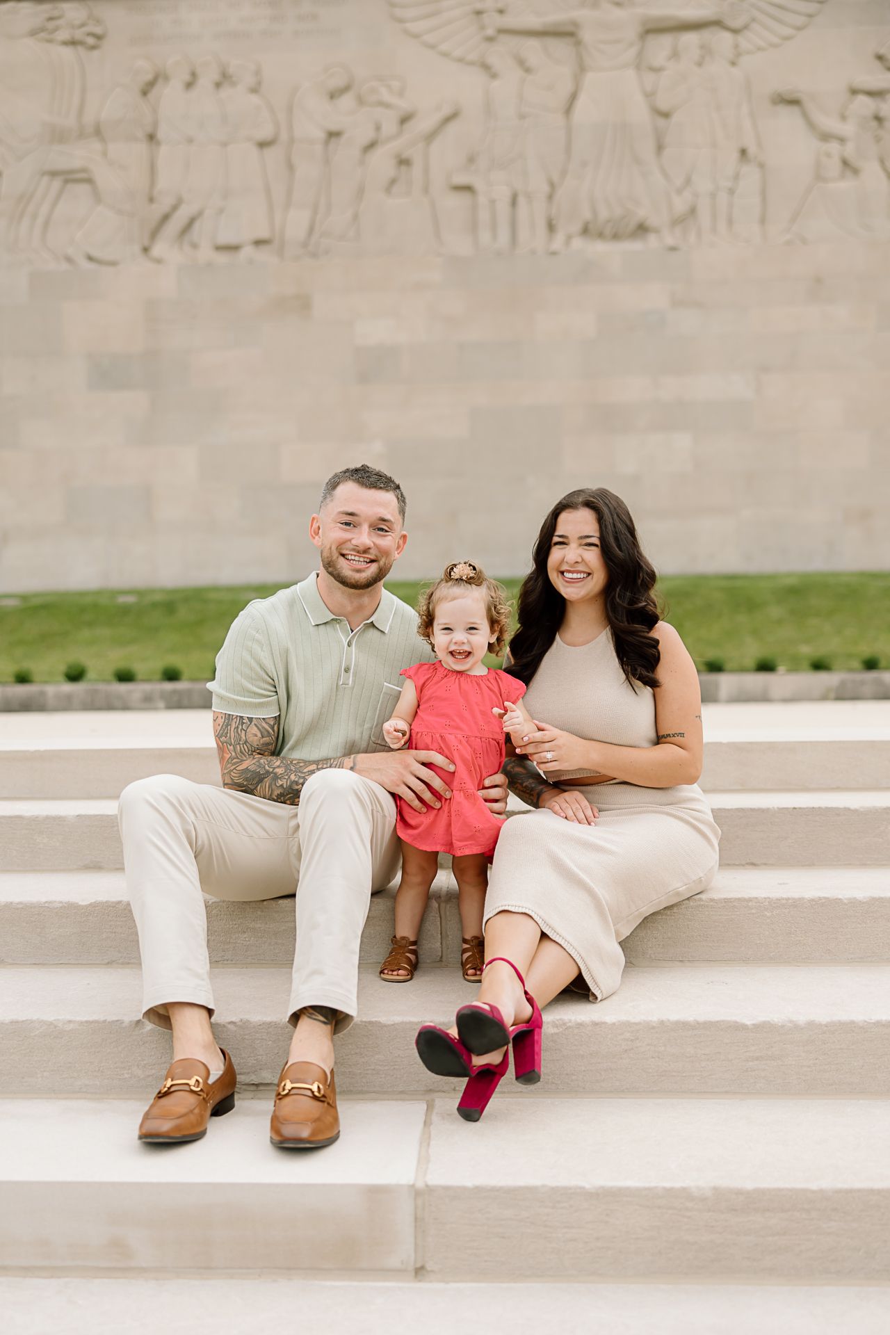A family sits together on concrete steps wearing coordinated neutral-toned outfits in a series of candid outdoor photos.