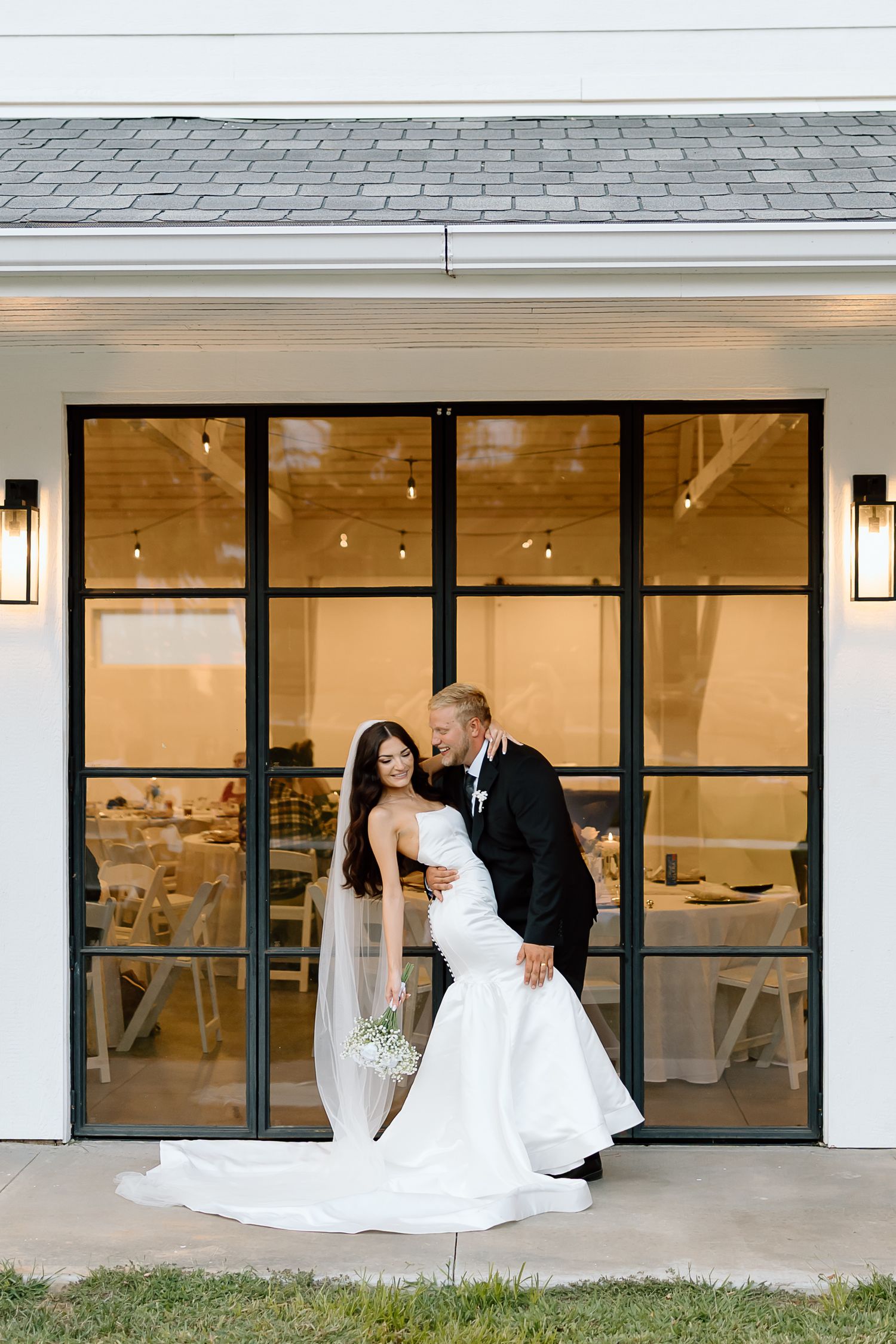 A romantic wedding photo sequence showing a couple in formal attire against a modern building exterior with large windows.