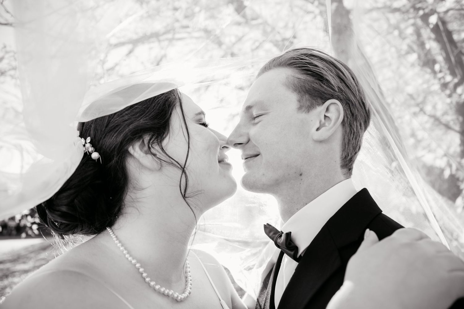 Black and white romantic portraits capturing intimate moments between a couple.