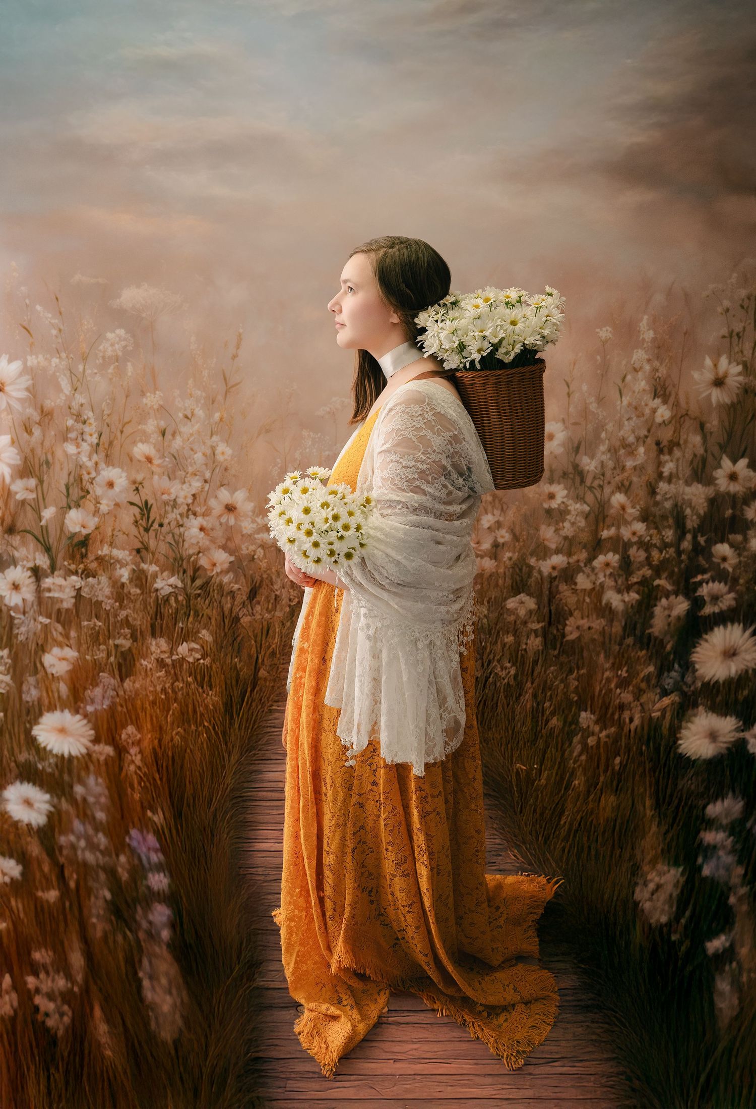 Ethereal portrait series in mustard colored dress against dreamy backdrop of white wildflowers at dusk.