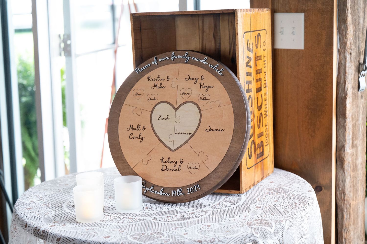 Rustic wooden decor displays with heart designs at a wedding venue.