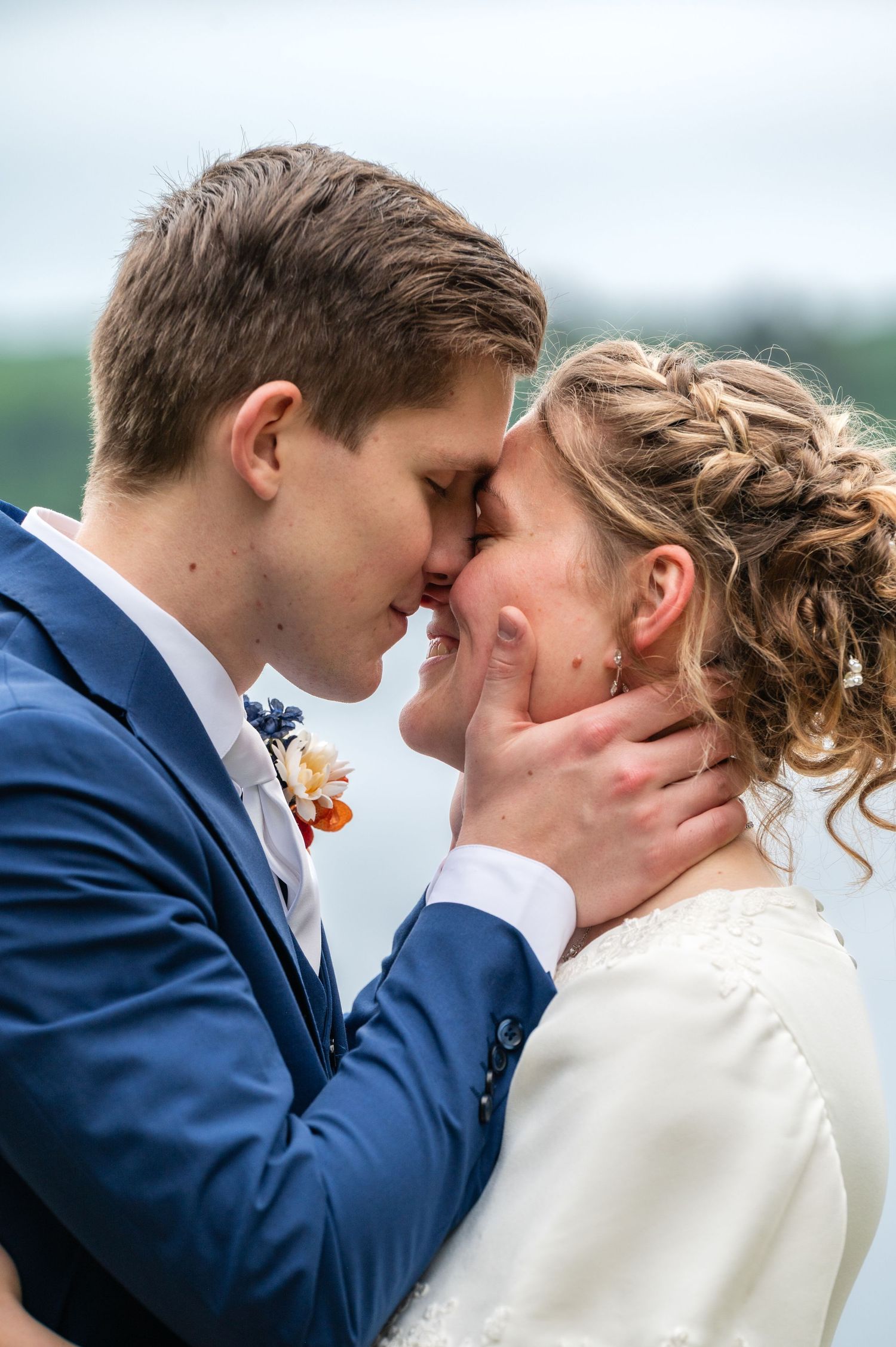 Romantic wedding couple sharing intimate kisses in a series of close-up photos against a blurred outdoor backdrop.