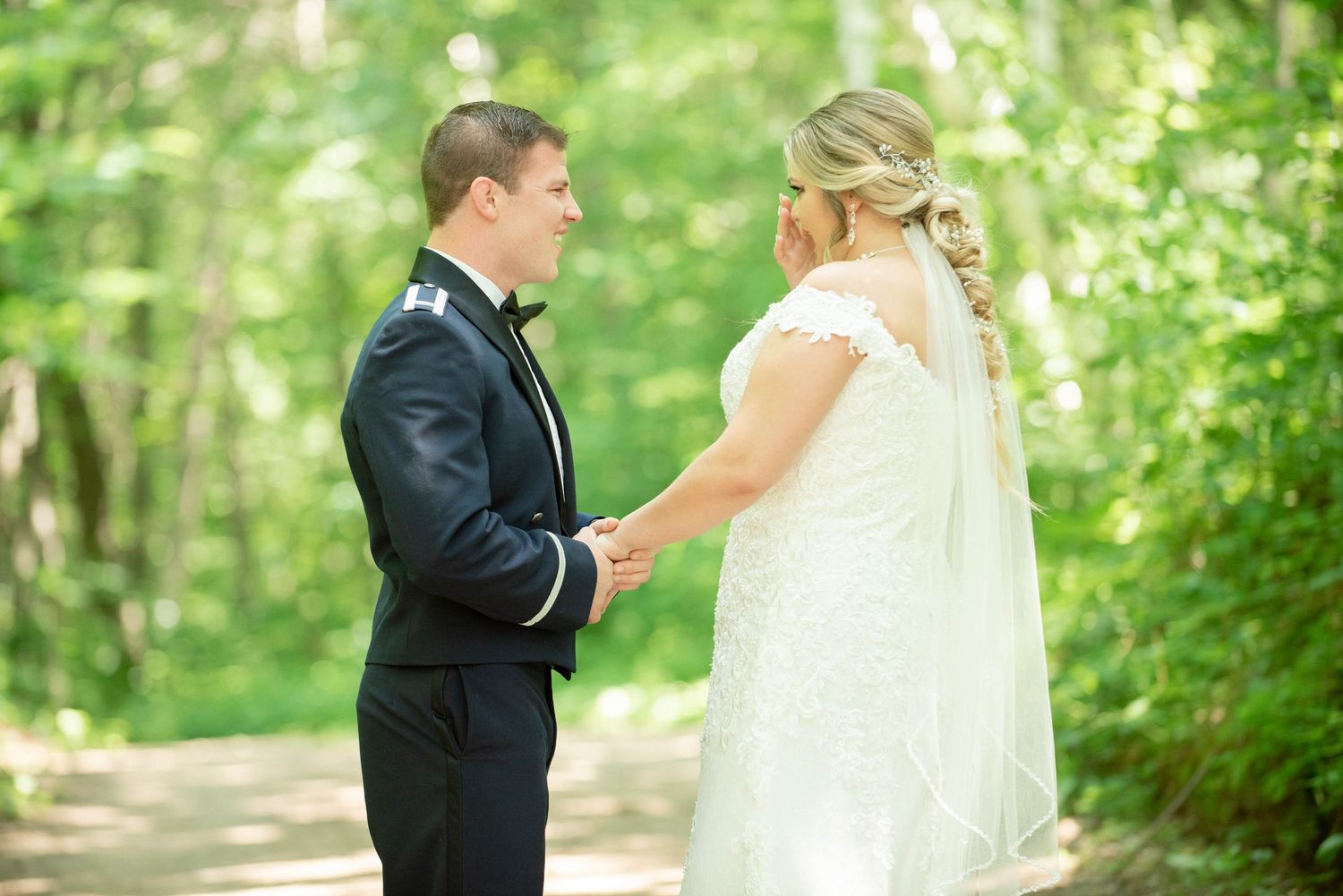 Intimate wedding moment captured between couple on wooded path during first look. Zimmerman MN Weddings