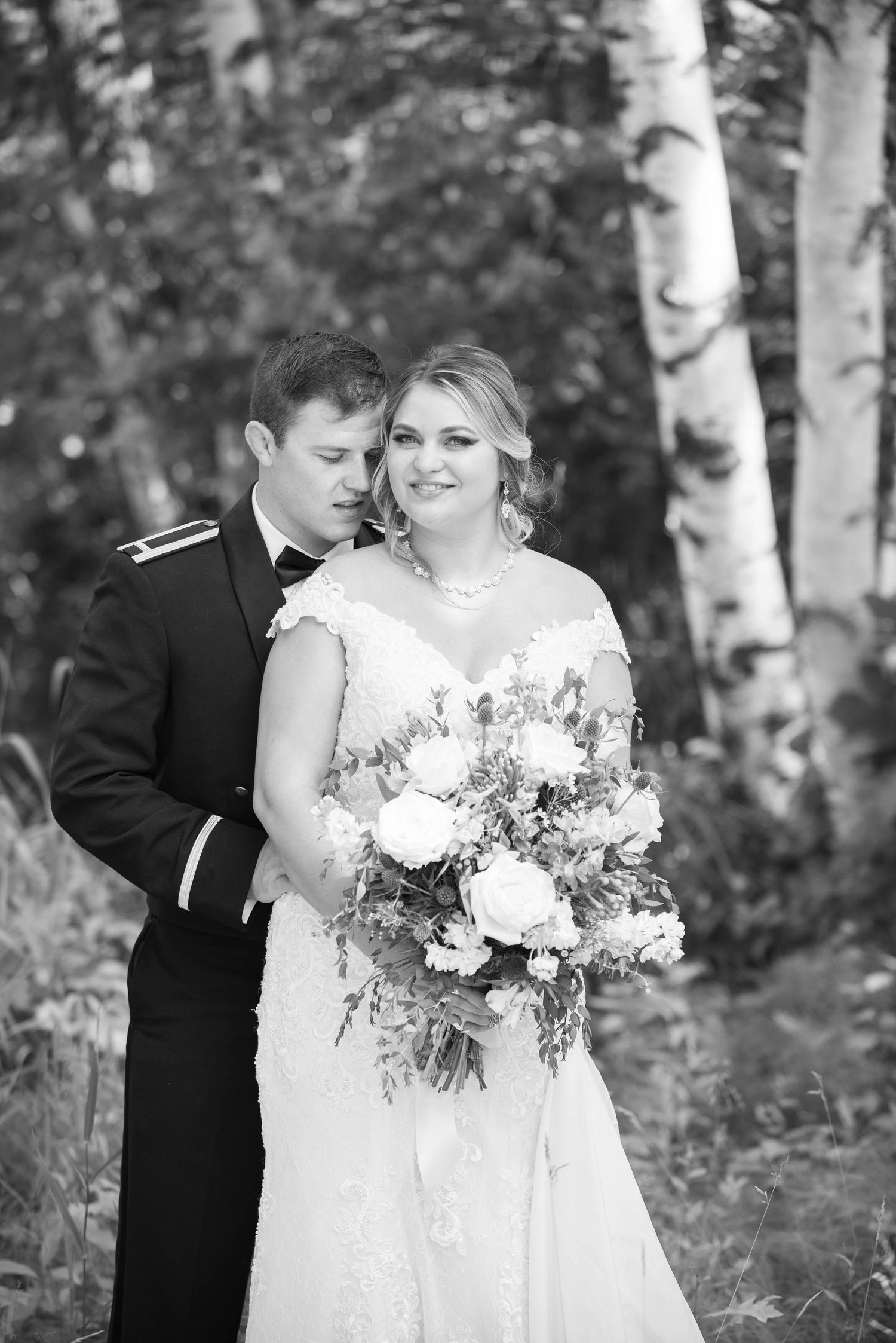 A romantic black and white portrait of a wedding couple among birch trees. Zimmerman MN Weddings
