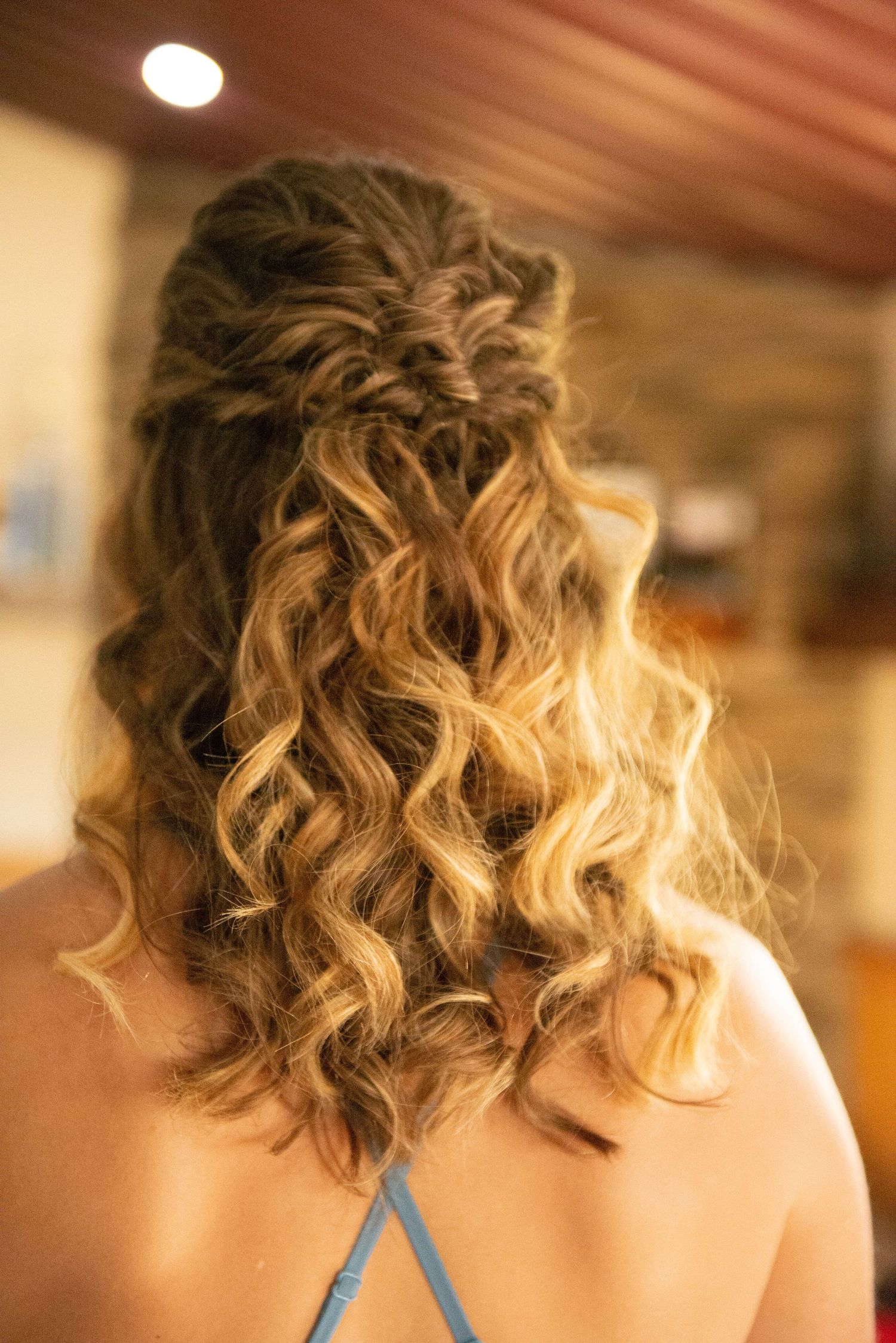 Close-up views of elegantly styled curly blonde hair with subtle highlights and romantic texture. Zimmerman MN Weddings