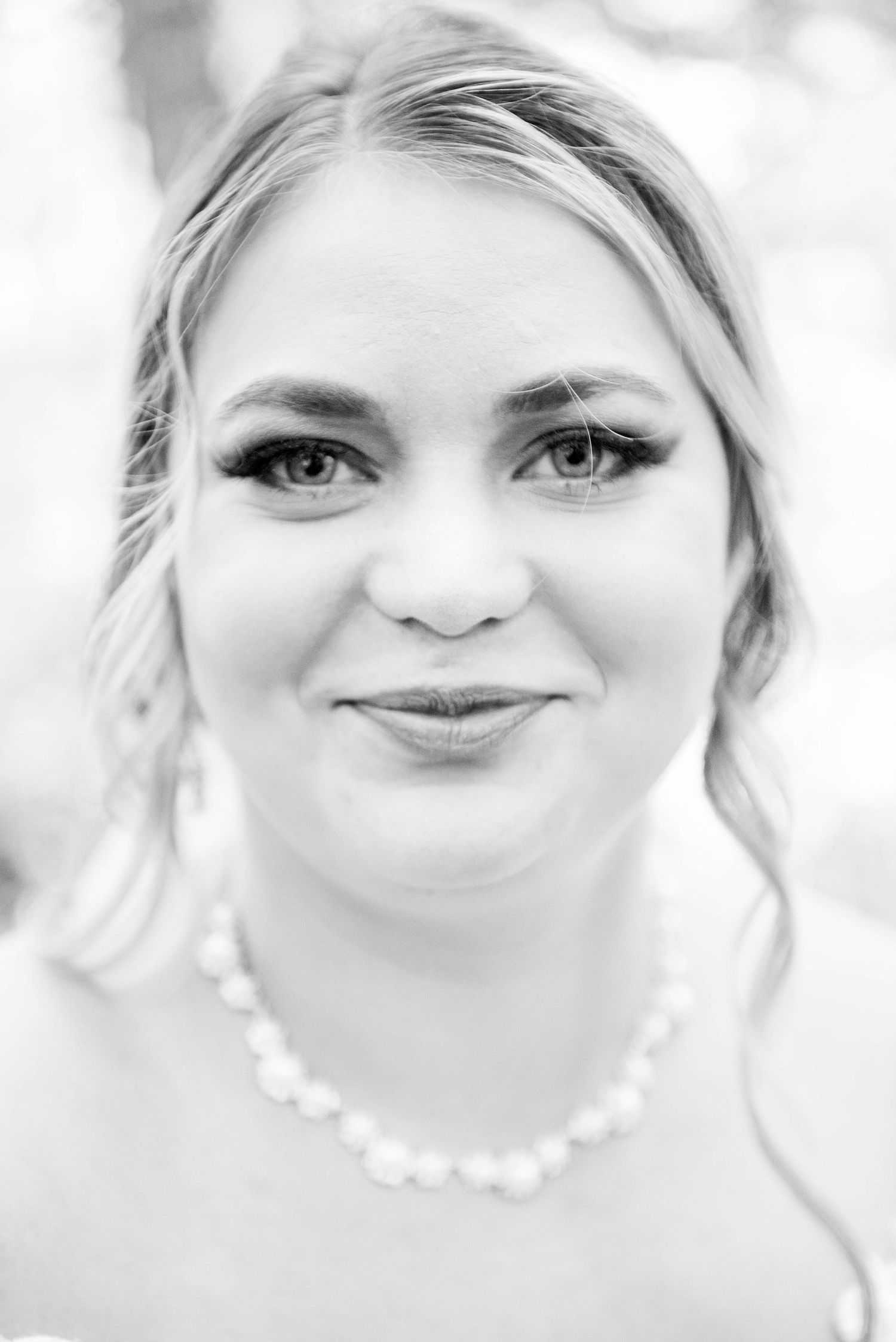 Classic black and white bridal portrait with pearl necklace and natural makeup. Zimmerman MN Weddings