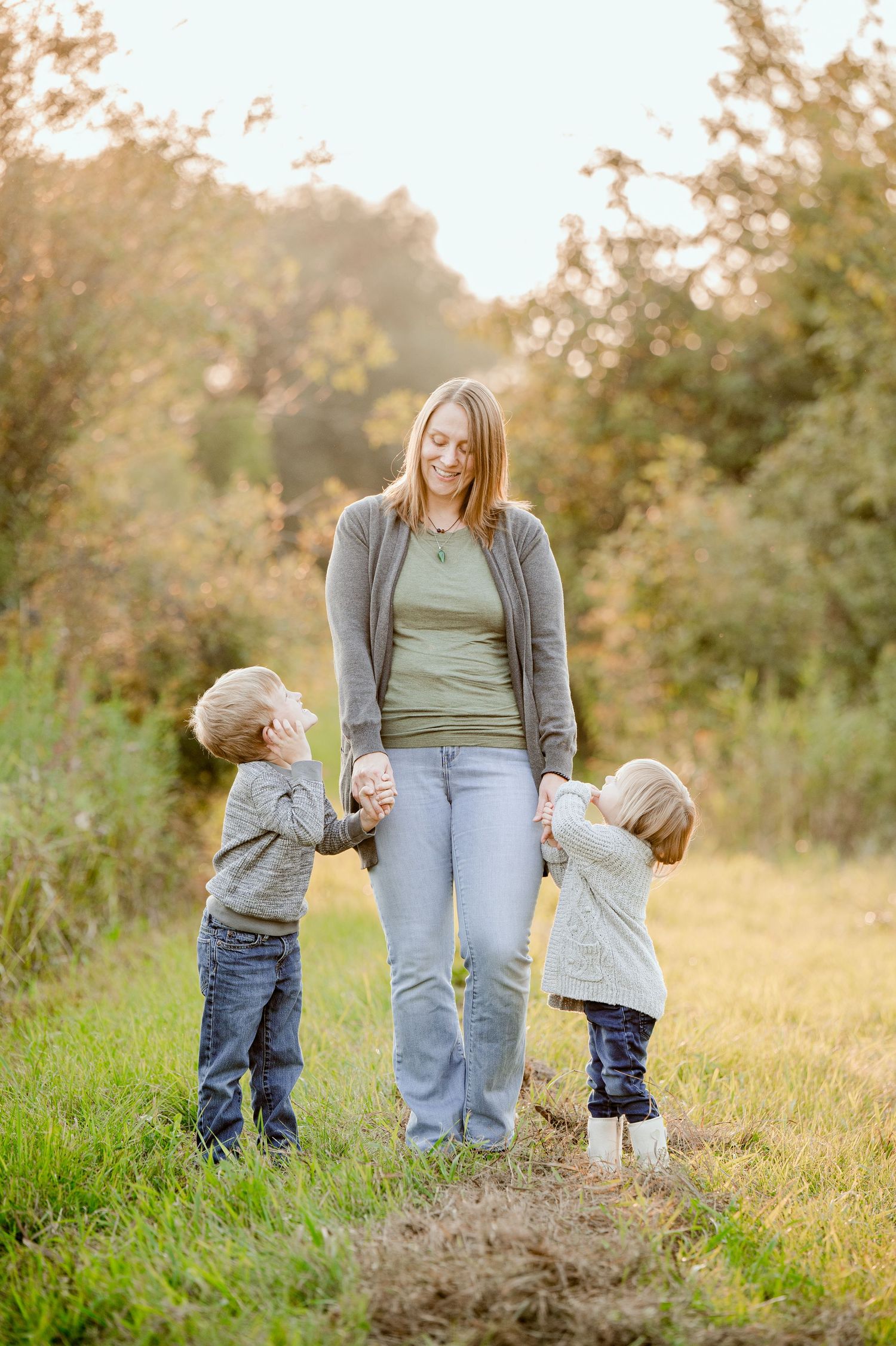 A sweet moment captured on a nature path during golden hour.