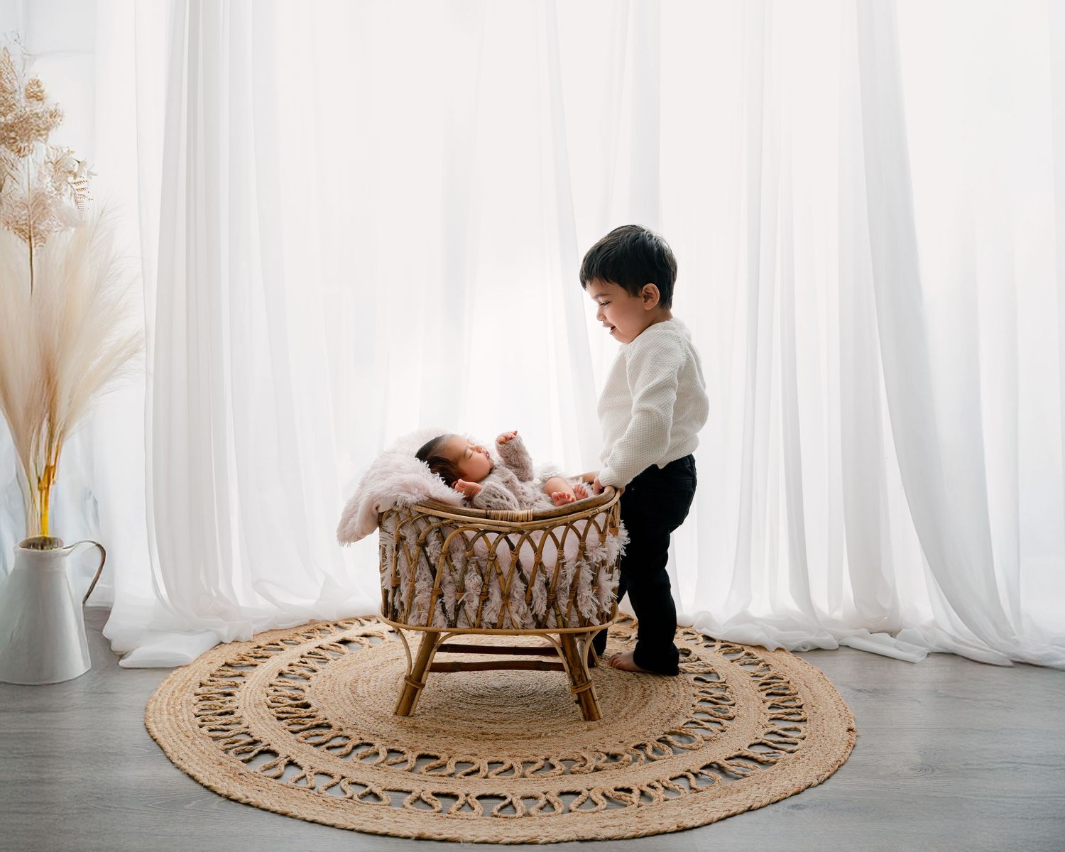 A circular woven jute rug shows people interacting with it in a bright white room across four sequential photos.