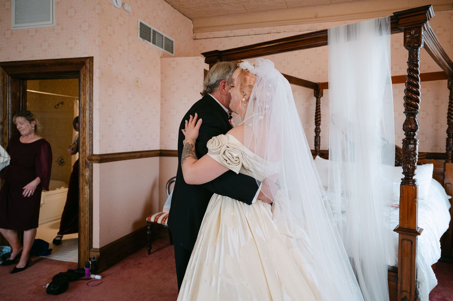 Central MN Wedding Photos | Emotional father embracing daughter in champagne ball gown wedding dress during first look moment.