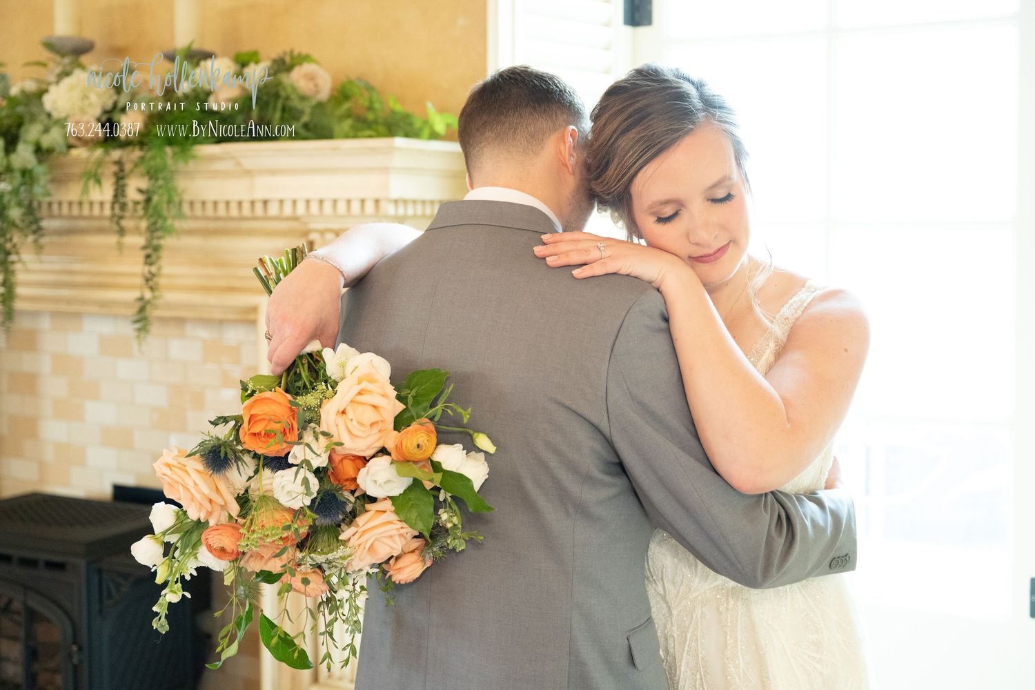 Bride and groom share tender embrace during wedding ceremony, bride holding lush peach and orange floral bouquet with greenery. Crooked Will