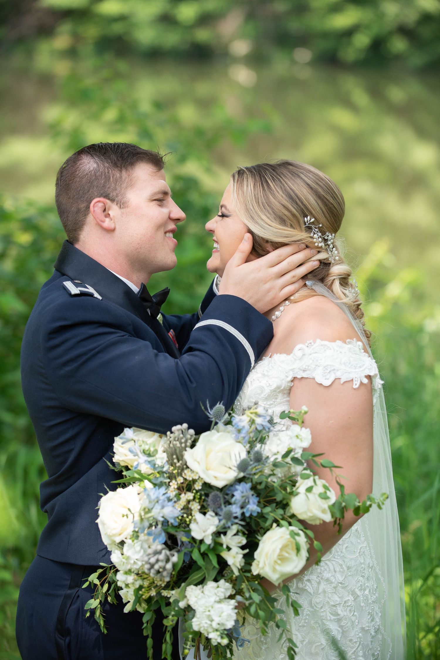 Romantic wedding portrait with white and blue bouquet in a garden setting. Zimmerman MN Weddings
