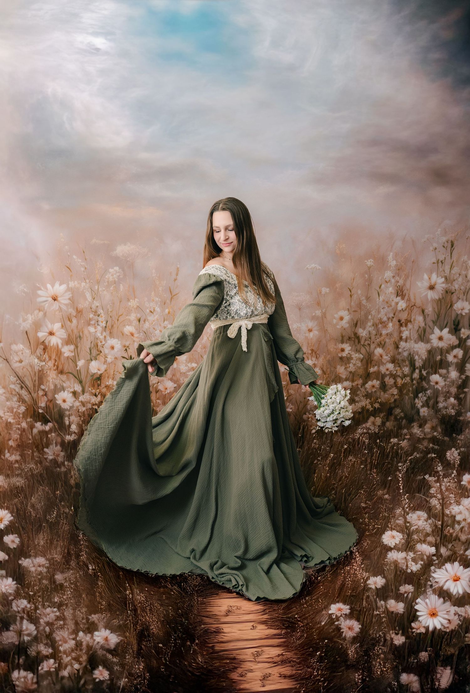 Woman in green medieval gown holding white flowers in a dreamy daisy field under a soft cloudy sky.
