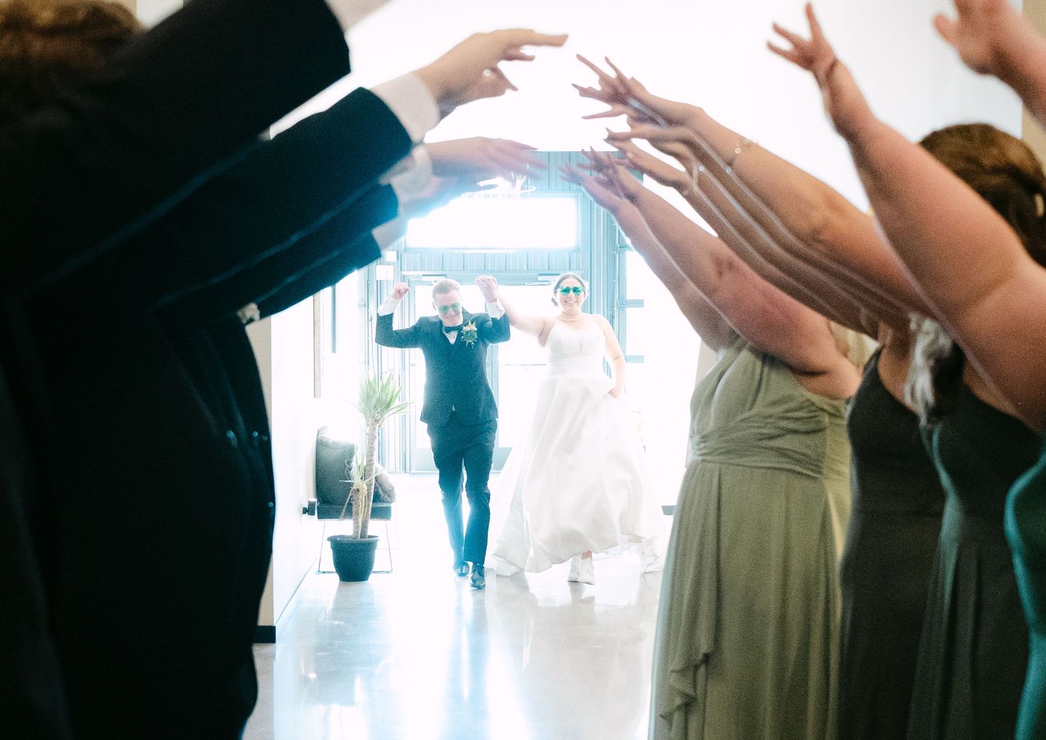 A sequence of dance floor photos showing people with raised arms celebrating at a wedding reception.