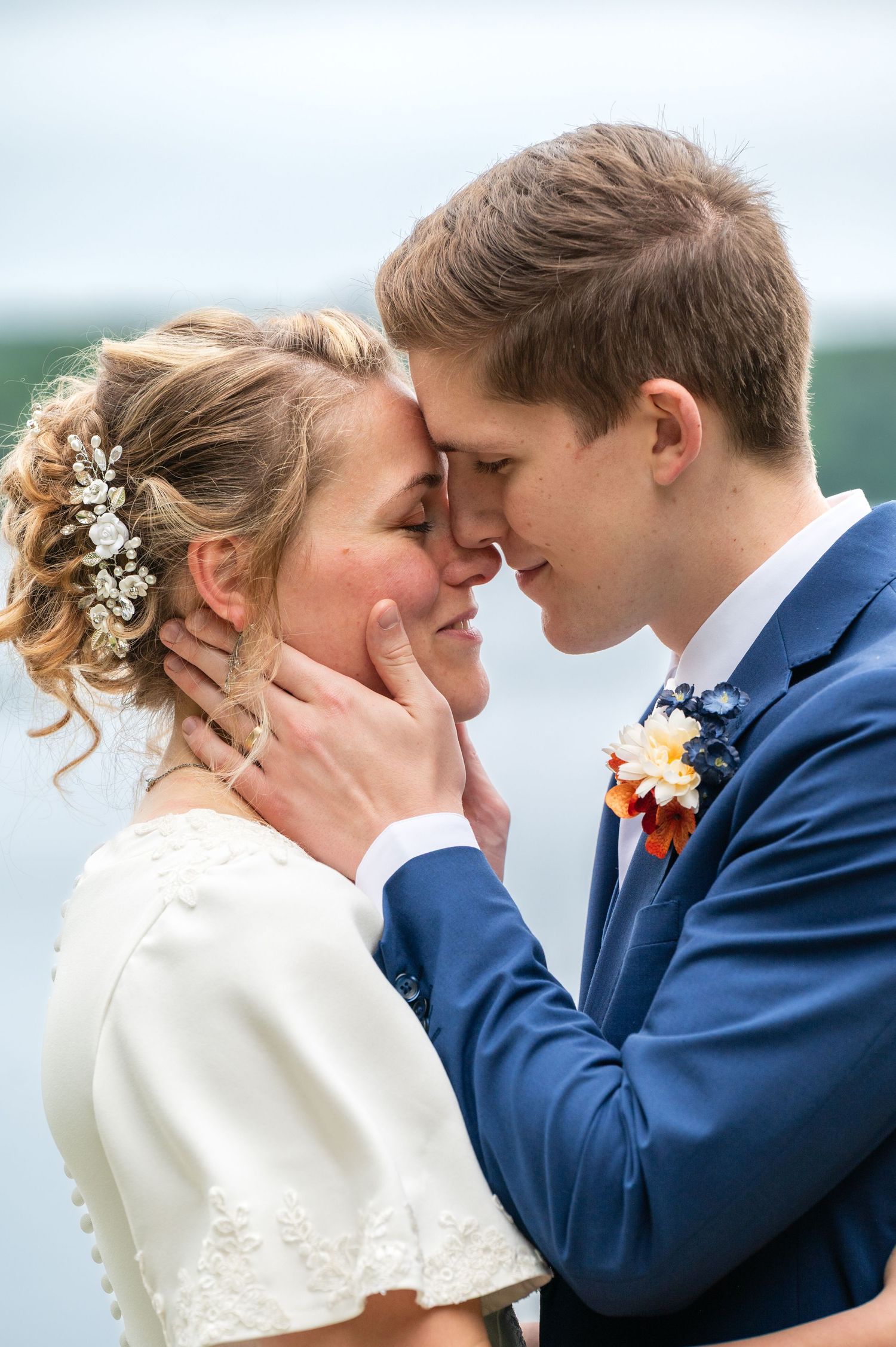 A romantic wedding sequence shows a couple in navy and white sharing tender moments by the waterfront.