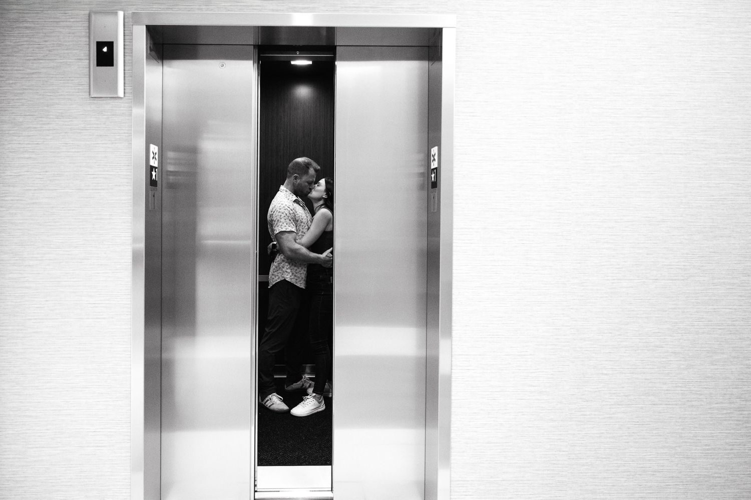 A series of black and white photographs showing moments inside an elevator.