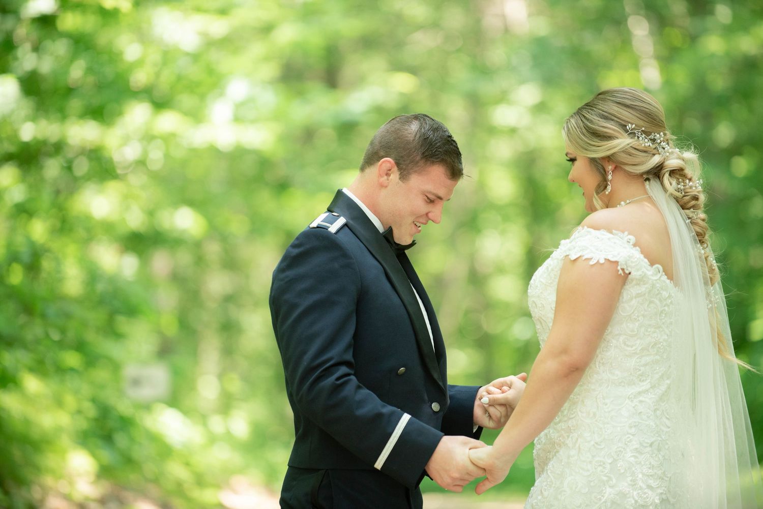 Wedding couple exchanging rings during an intimate outdoor forest ceremony. Zimmerman MN Weddings