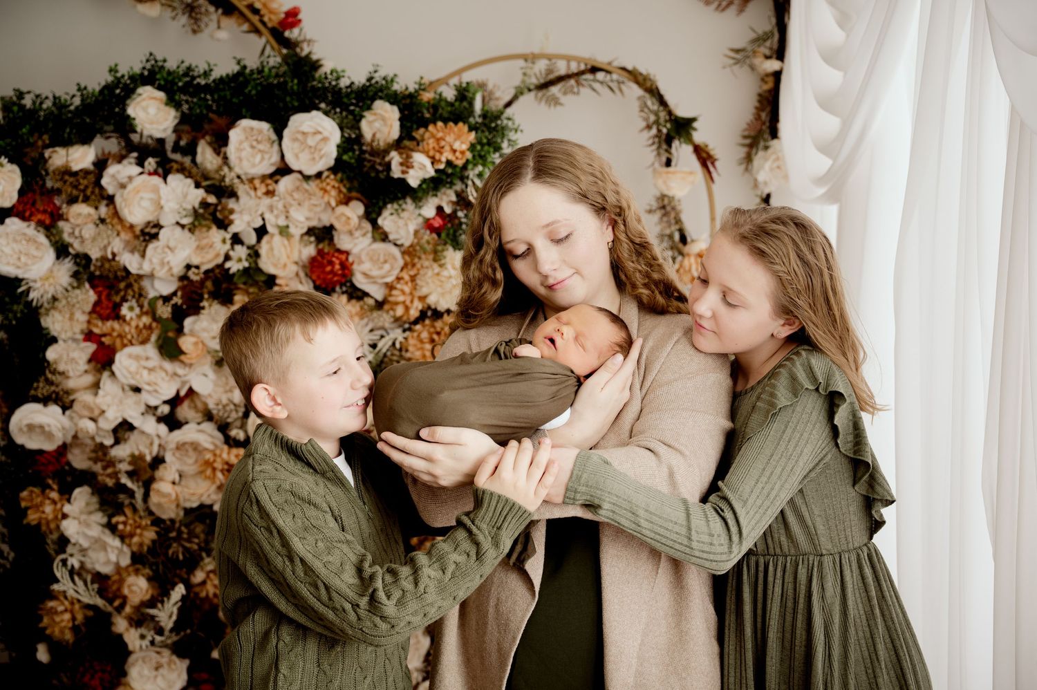 Four candid casual family photos showing parents and children sitting together in warm indoor lighting with floral decorations.