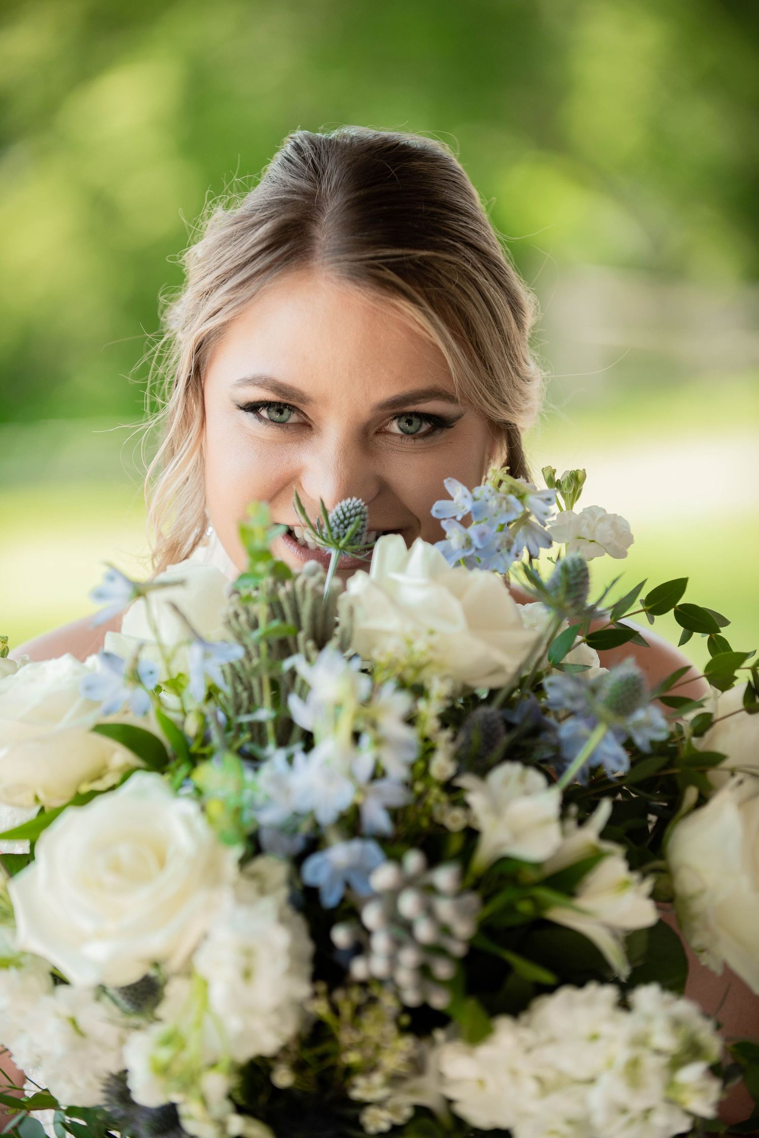 A beautiful bouquet of white and pale blue flowers with fresh greenery. Zimmerman MN Weddings