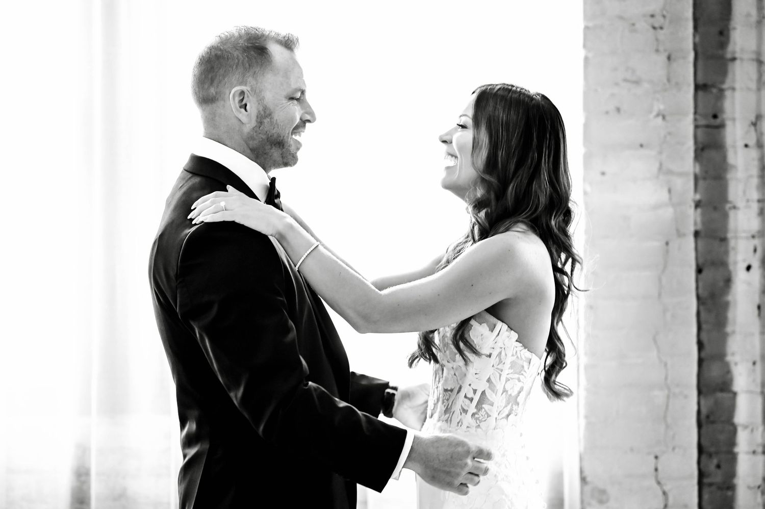 A couple shares intimate moments in black and white wedding photos showing romance and celebration.