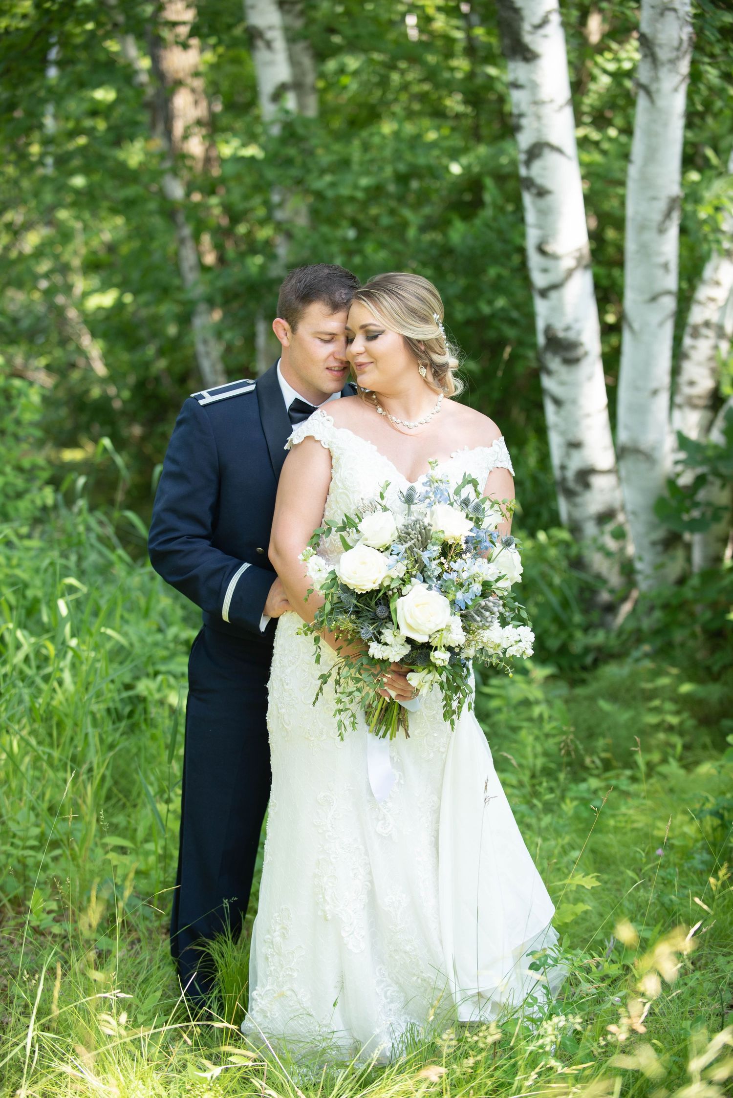 Intimate wedding portrait amidst birch trees with white floral bouquet. Zimmerman MN Weddings