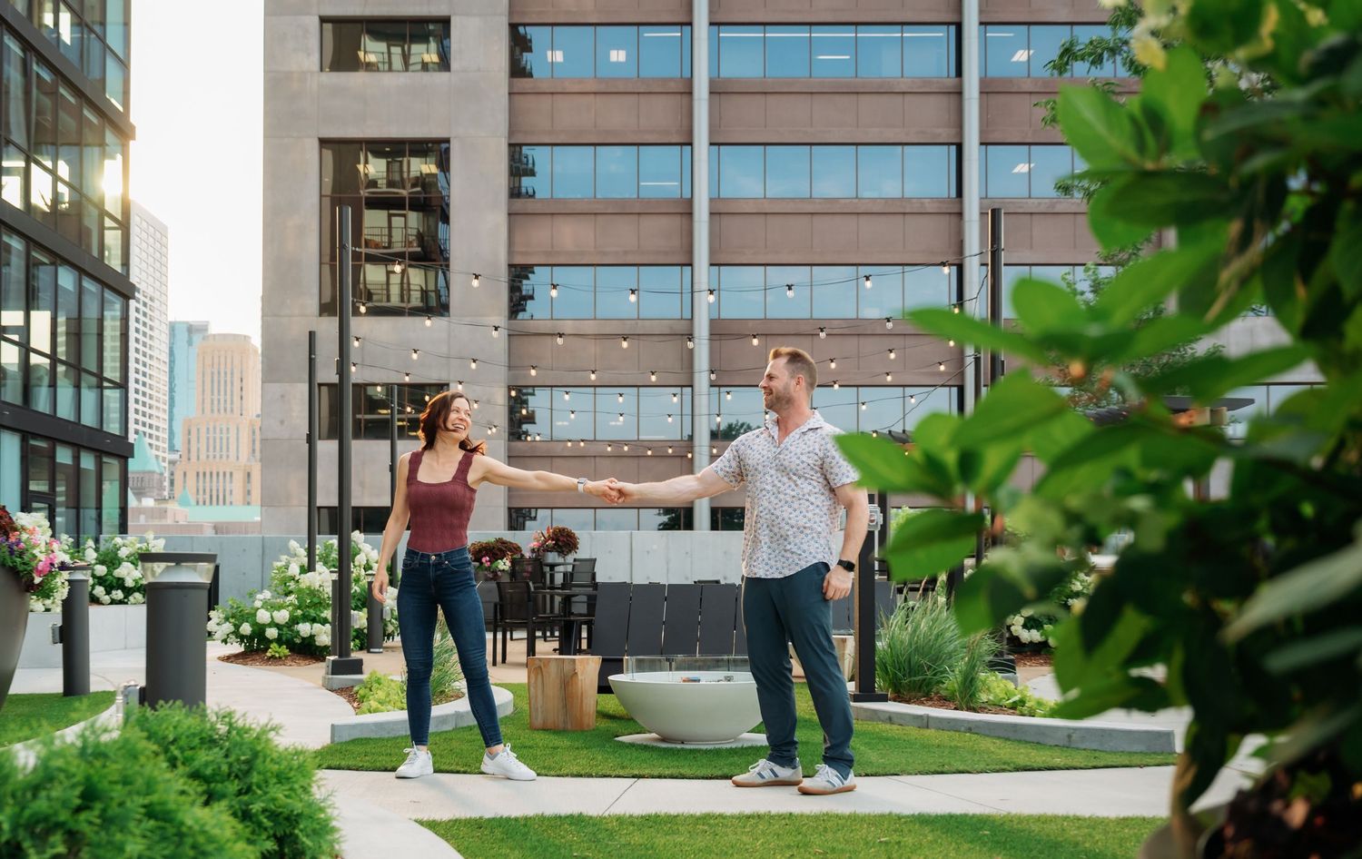 A contemporary urban rooftop garden with modern architecture and landscaping elements.