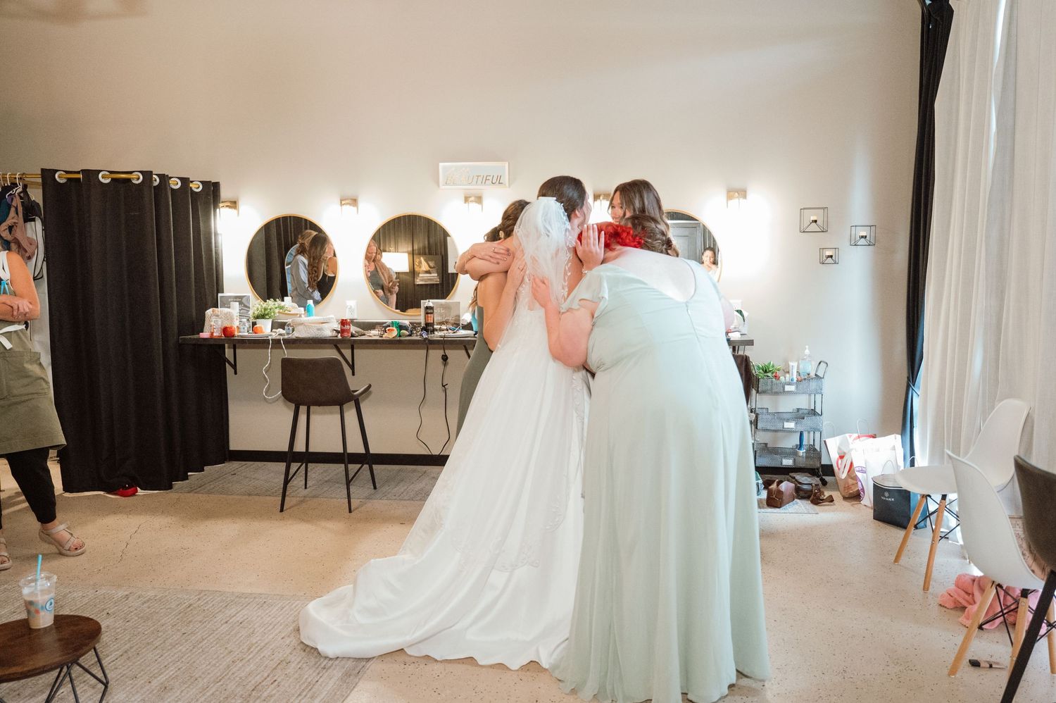 A panoramic view of a bridal boutique interior showing elegant wedding gowns and soft lighting.