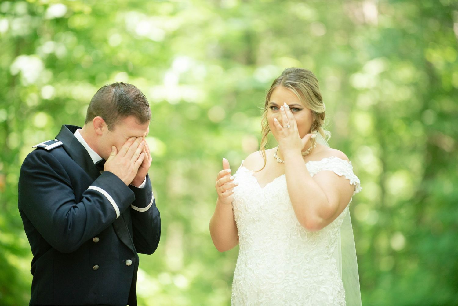 Romantic outdoor first look moment between newlyweds surrounded by lush greenery. Zimmerman MN Weddings