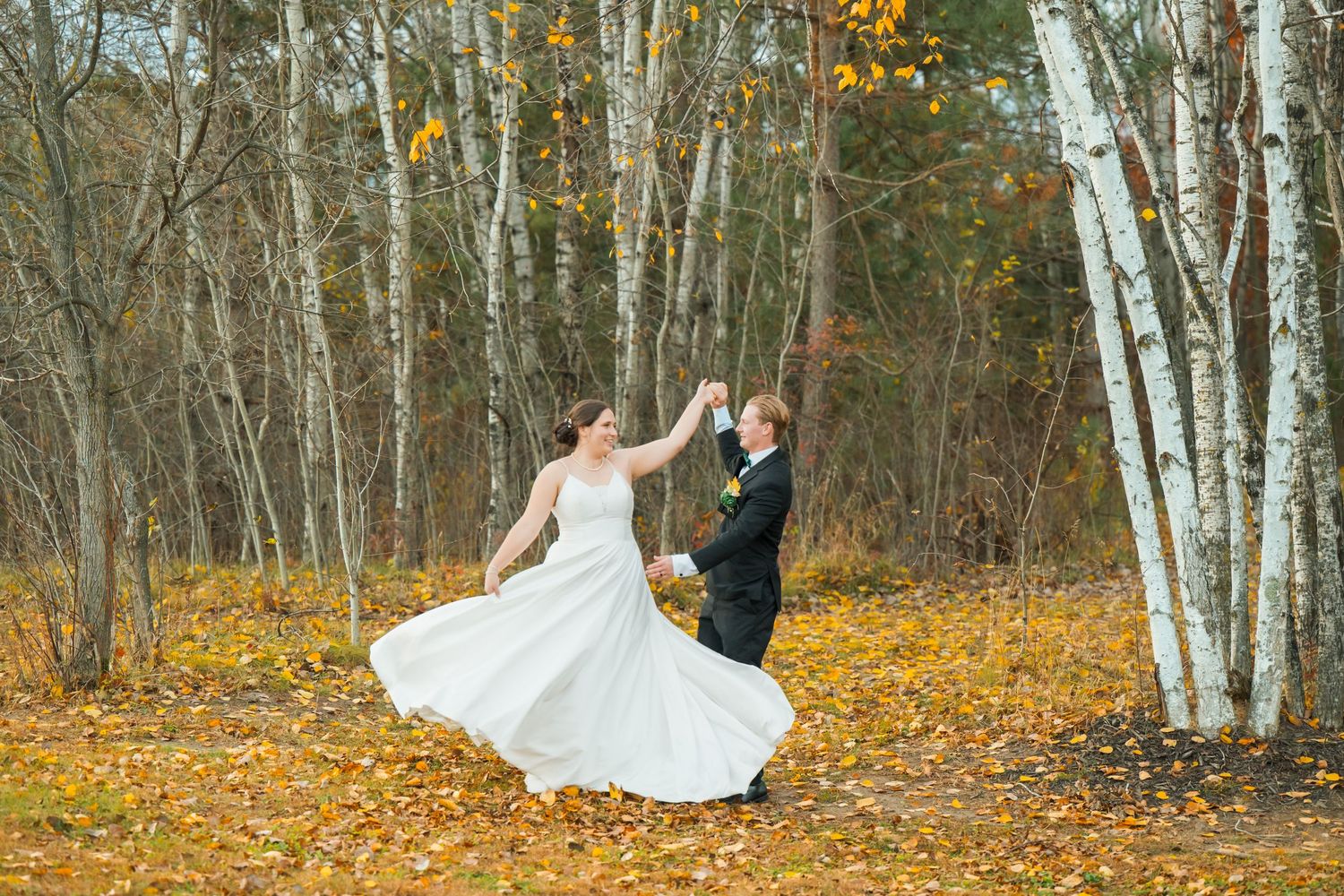 Wedding photography sequence showing romantic dance moves among autumn trees.